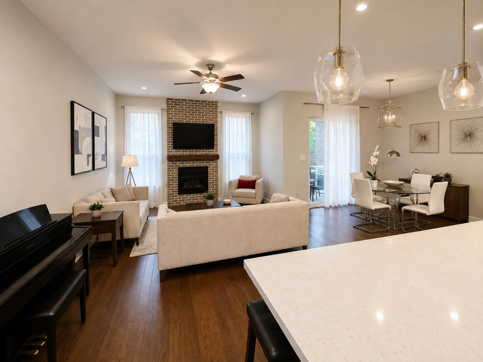Open-concept living space featuring wood-finish flooring and light-toned walls