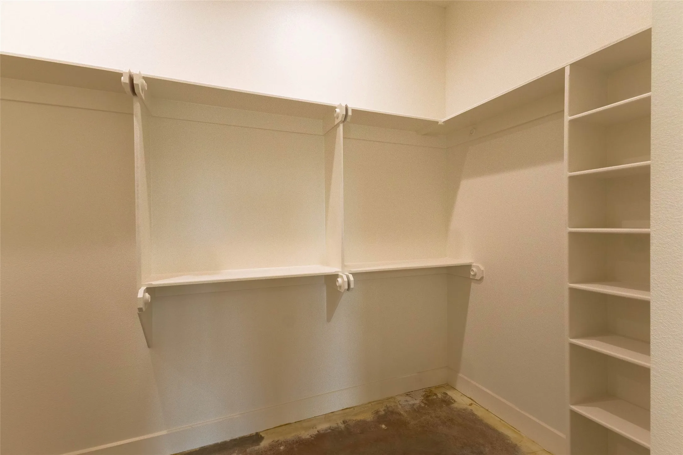 Built-in shelving, integrated hanging rods, and an alcove for additional storage