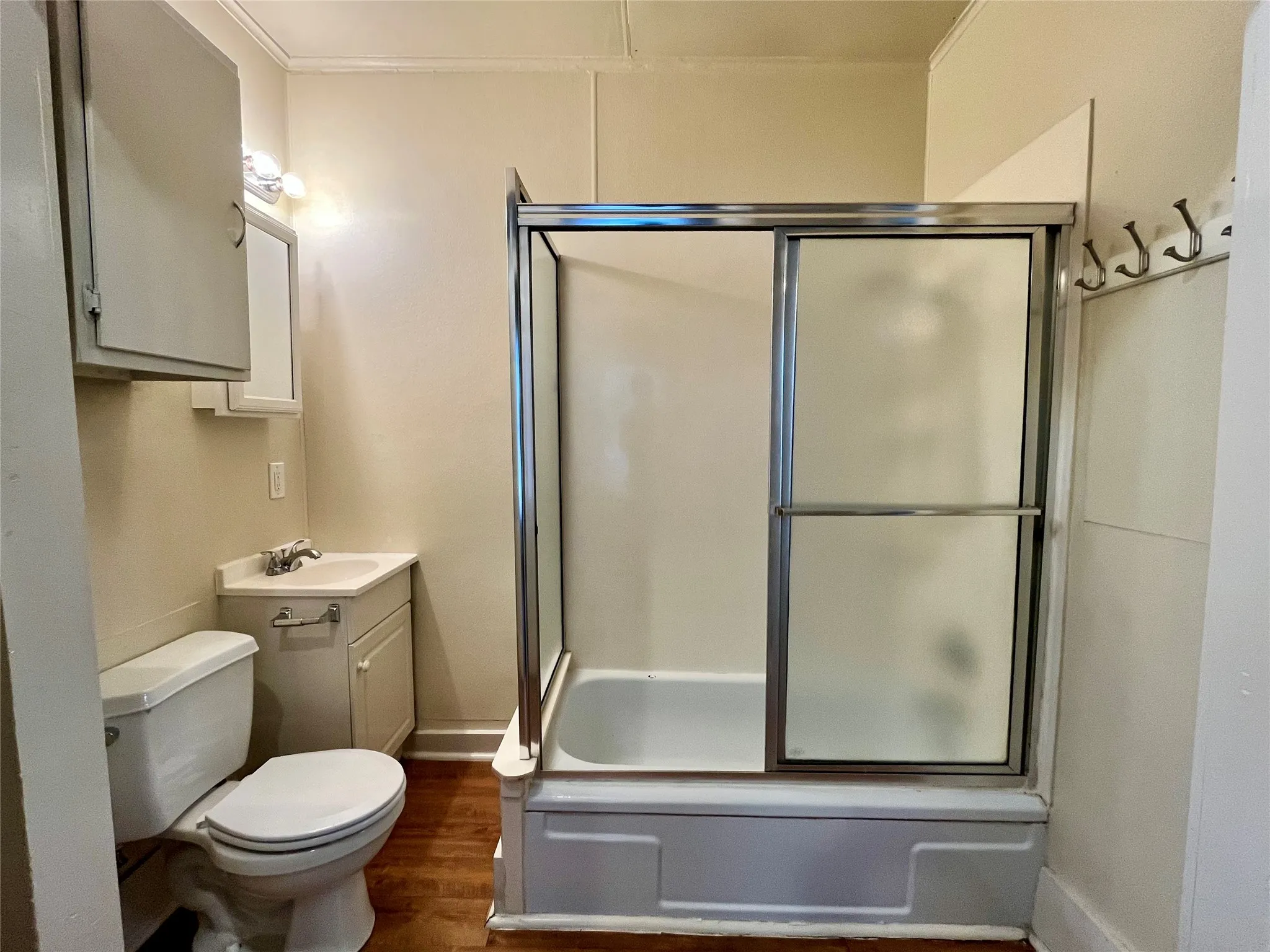 Clean, functional, and updated, this bathroom features a bright vanity and convenient built-in wall storage to keep your essentials organized.
