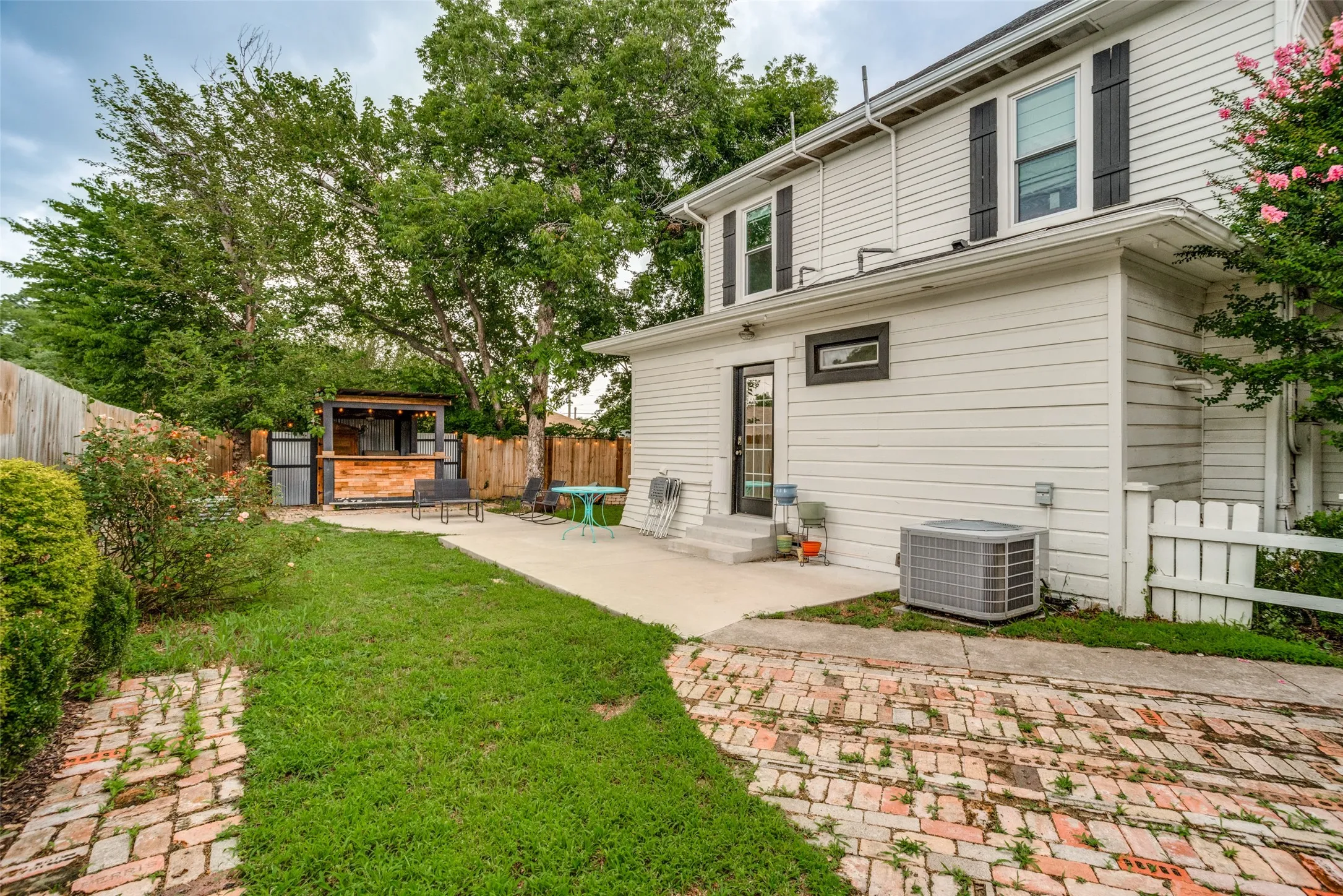BACK OF THE HOME WITH ENTERTAINING AREA