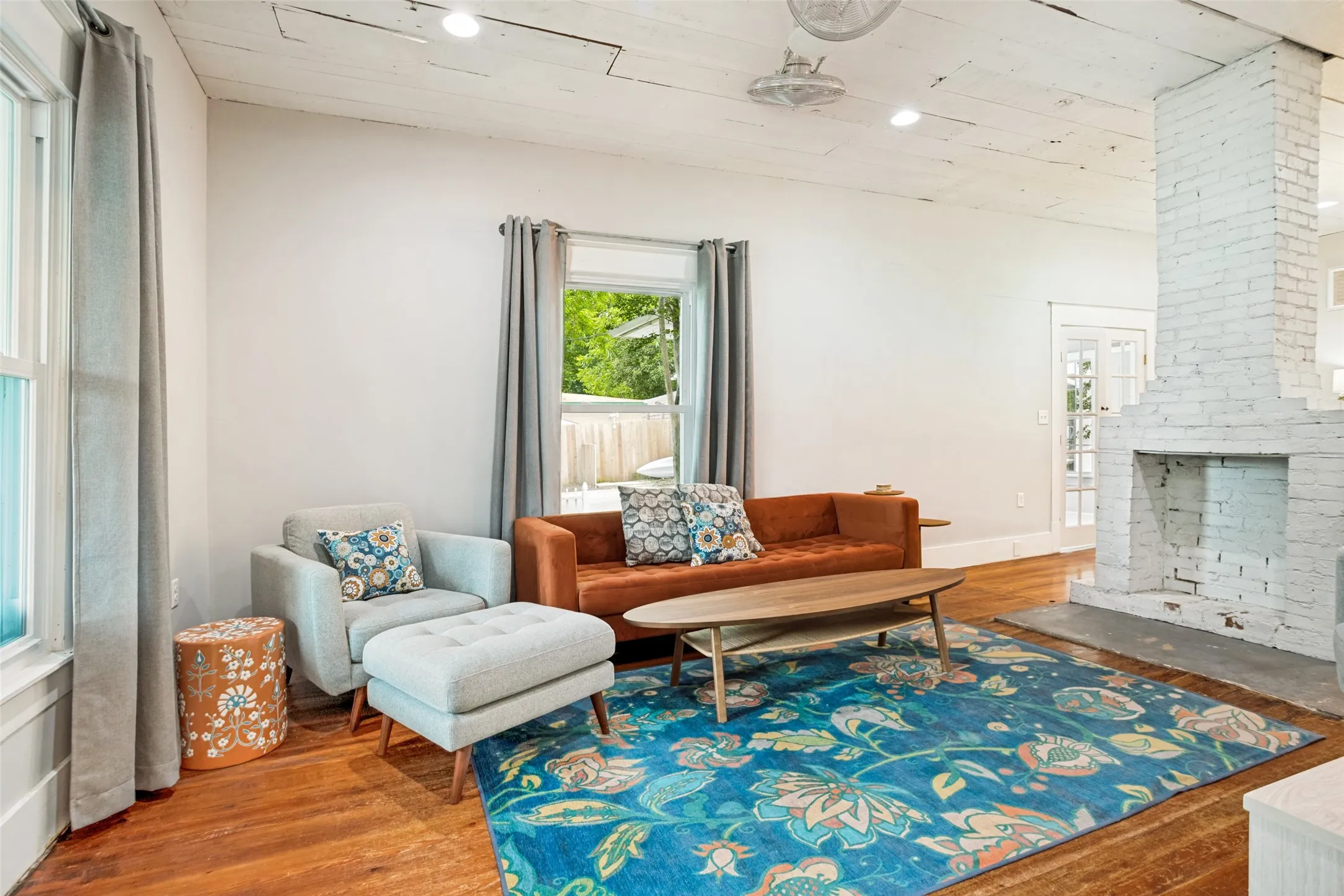 LIVING AREA HAS AN OPEN CONCEPT FEEL FULL OF CHARM THAT SITS ON THE FRONT OF THE HOME WITH ACCESS TO DINING AND KITCHEN AREA