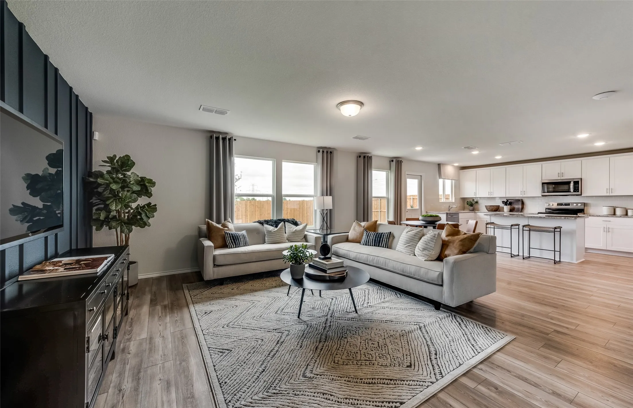 *Model Representation - Gathering room with view of main living areas