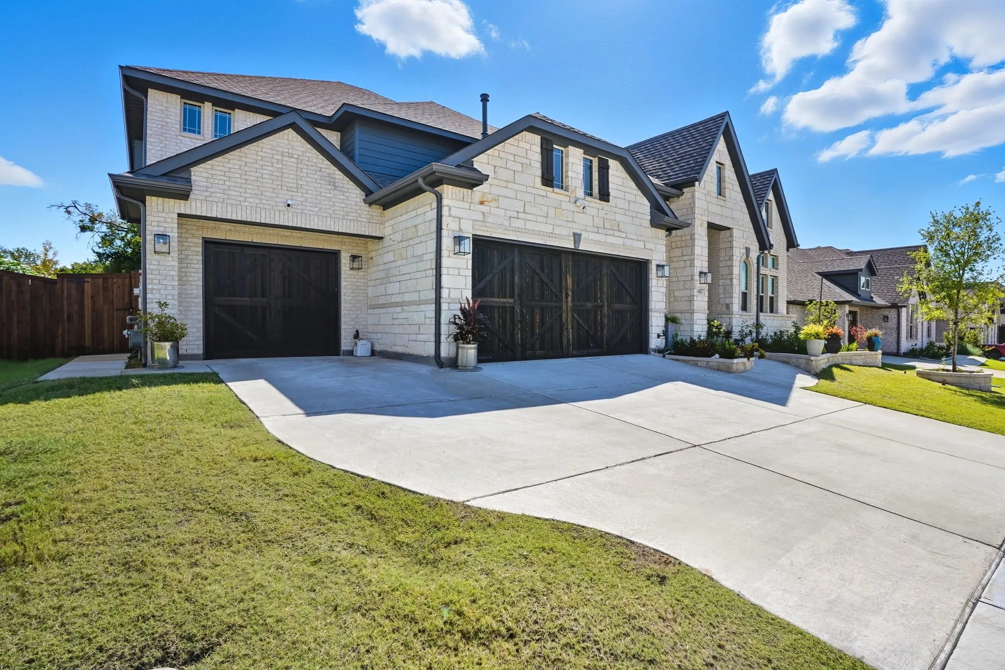 Stone and brick veneer exterior with a multi-gabled roofline