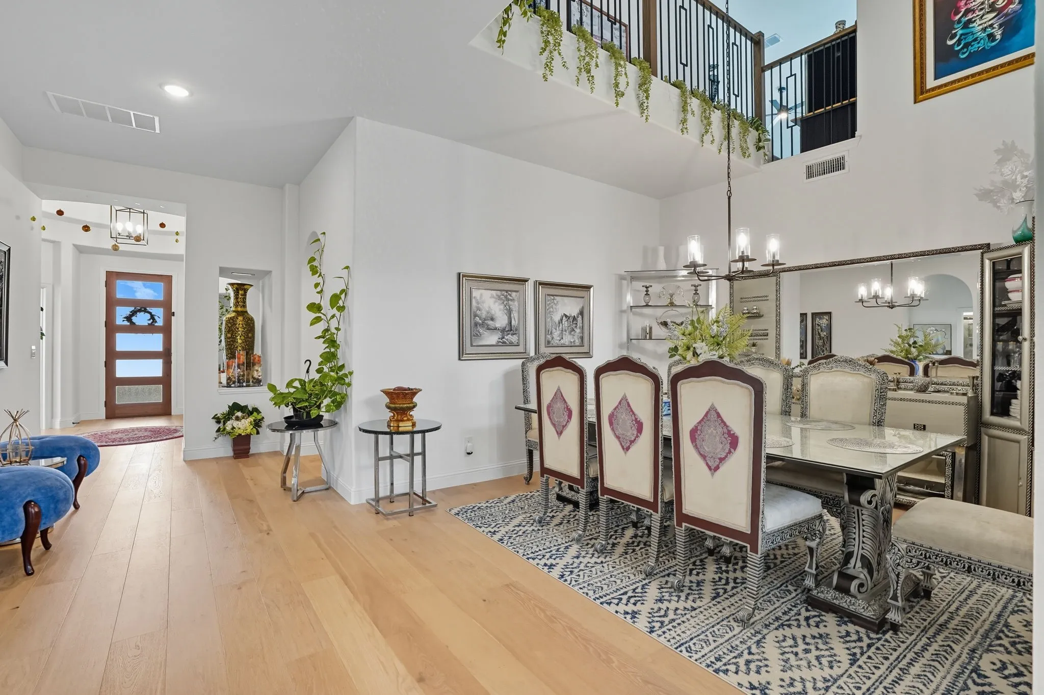 Dining area with a coffered ceiling and a multi-light chandelier