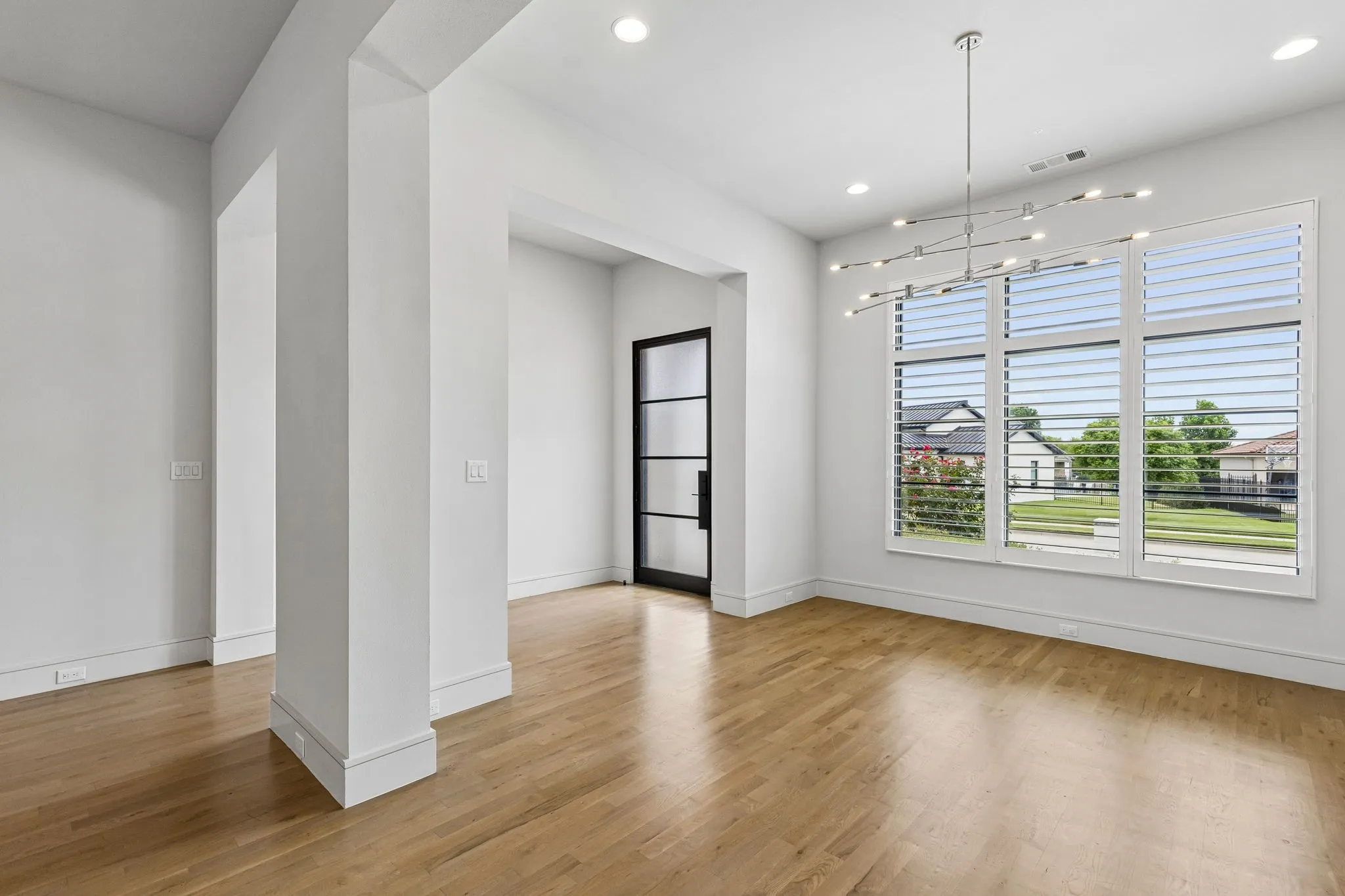 Open living plan: dining room has china hutch with wine frig