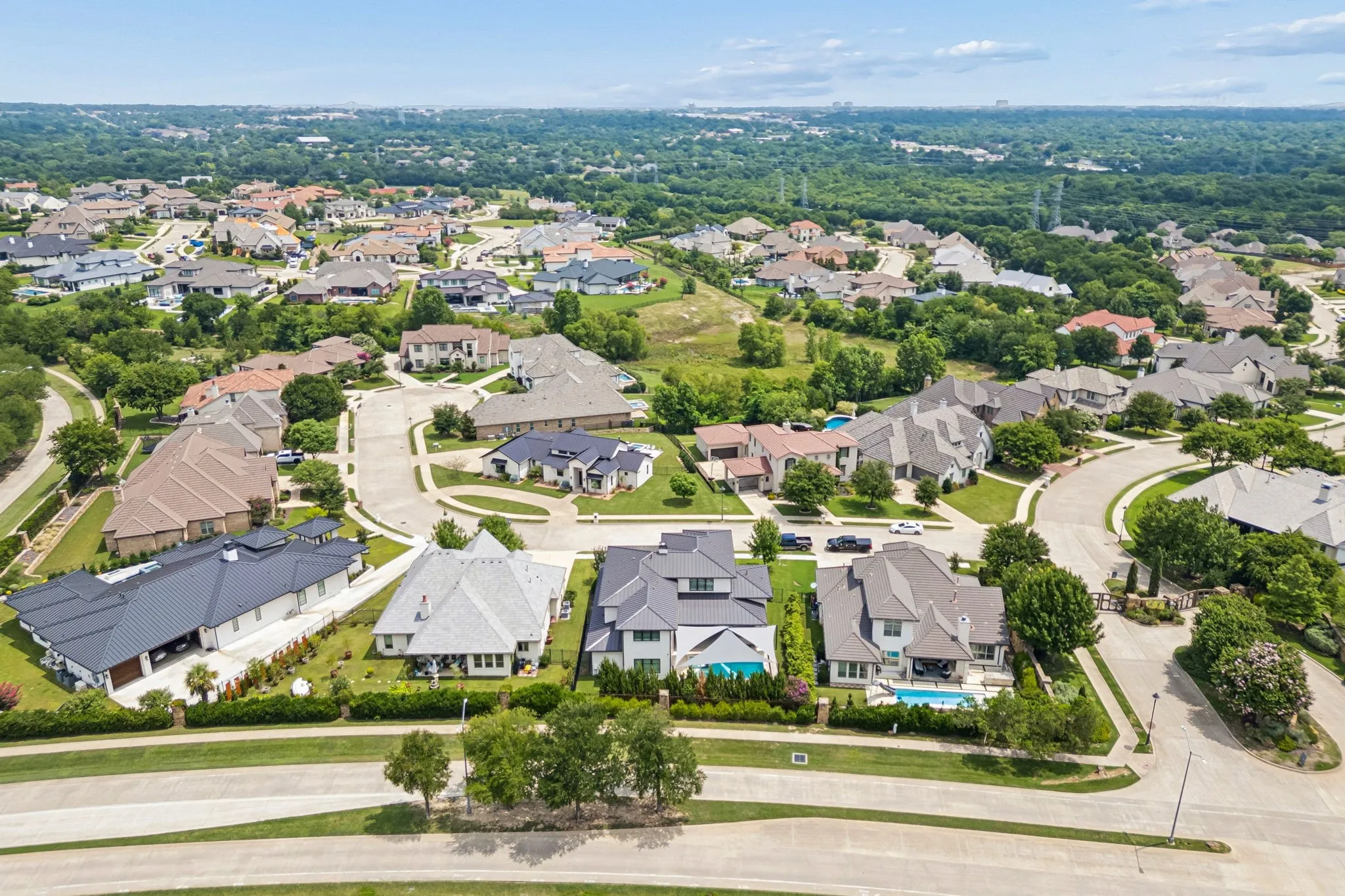 Looking into the gated subdivision toward Fort Worth