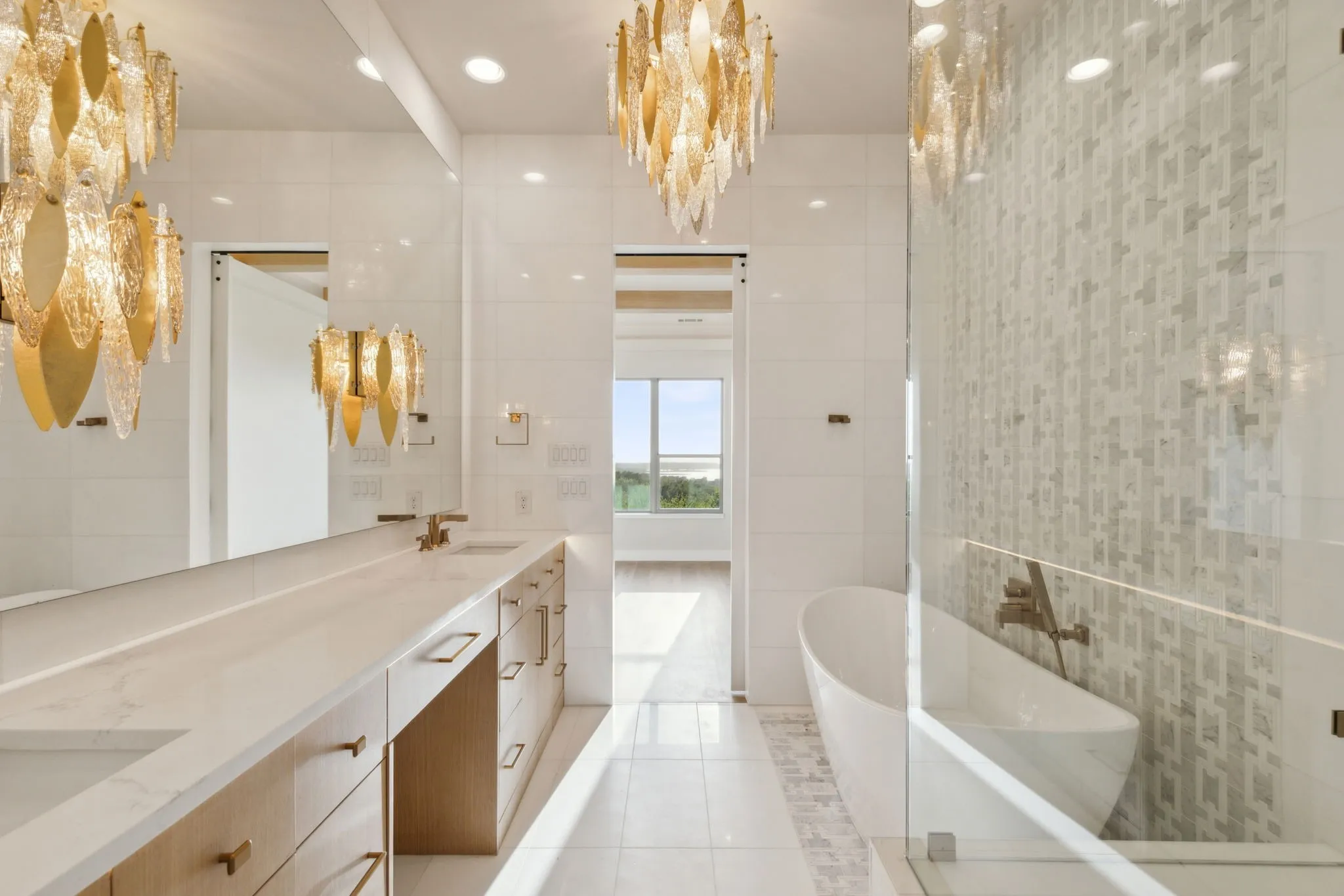 Full bathroom featuring tile walls, a soaking tub, double vanity, and tile patterned flooring