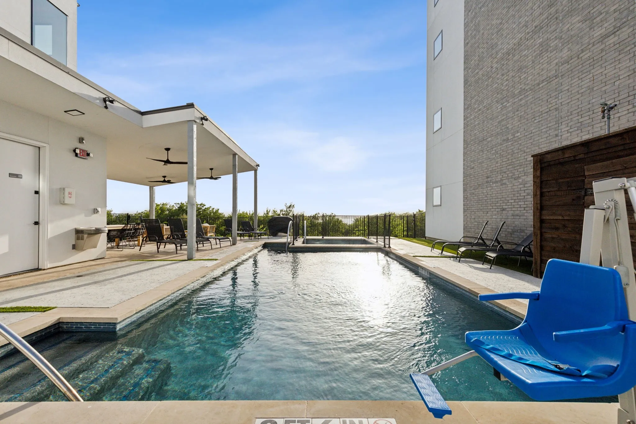 Swimming pool featuring a patio and a ceiling fan