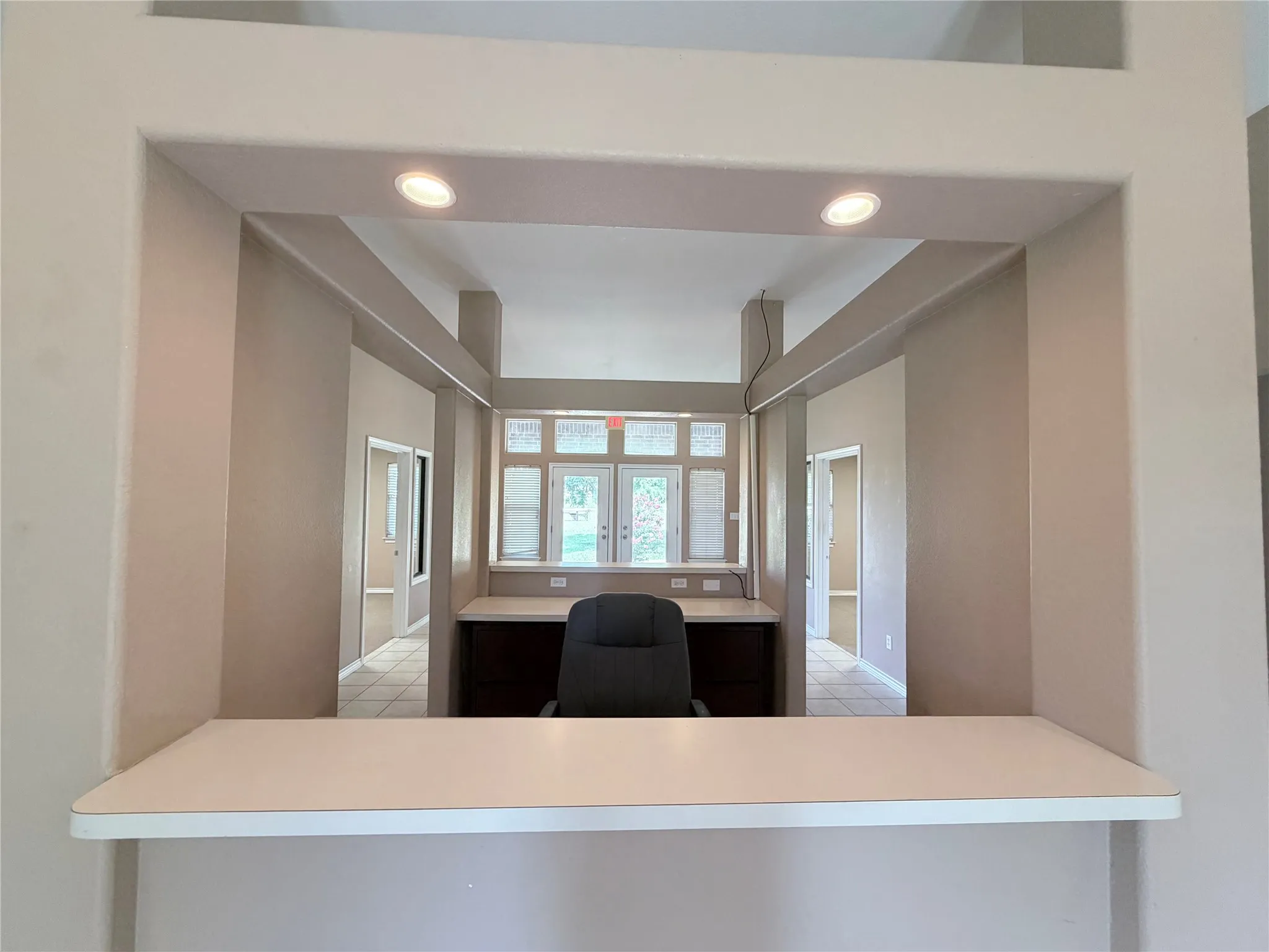 Pass-through window with integrated countertop and recessed lighting