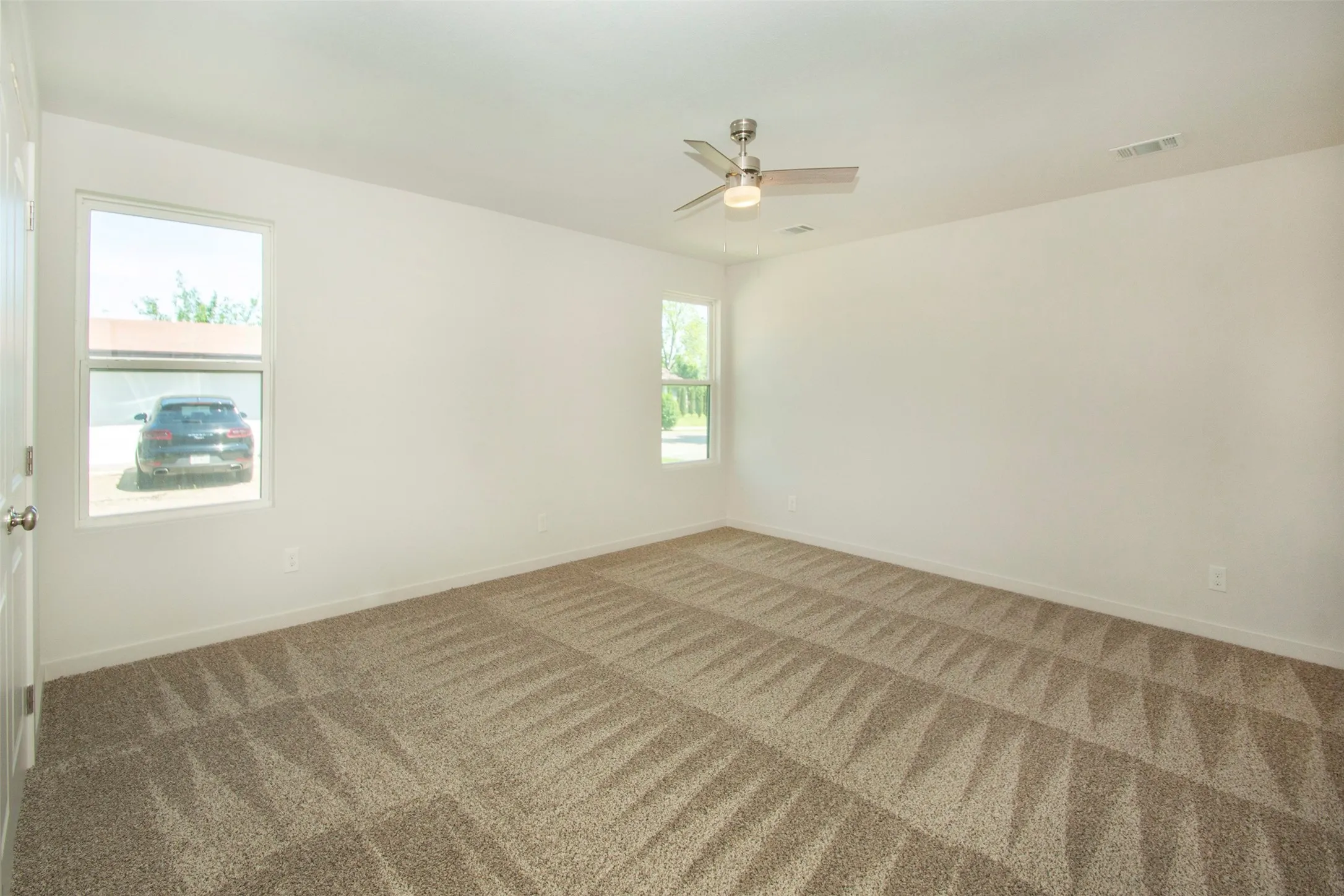 Bedroom featuring carpet flooring and ceiling fan