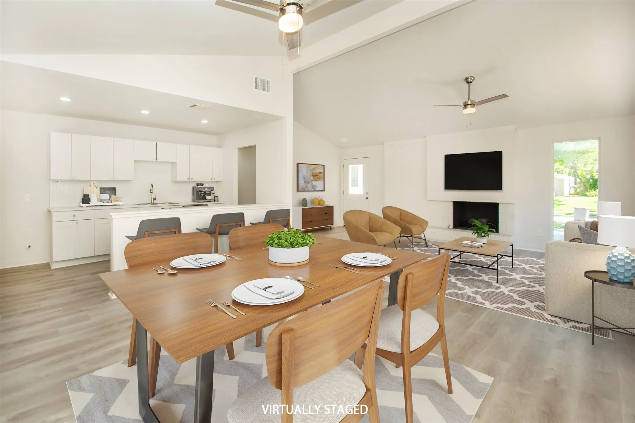 Virtual Staging Dining area with high vaulted ceiling, sink, ceiling fan, and light hardwood / wood-style floors