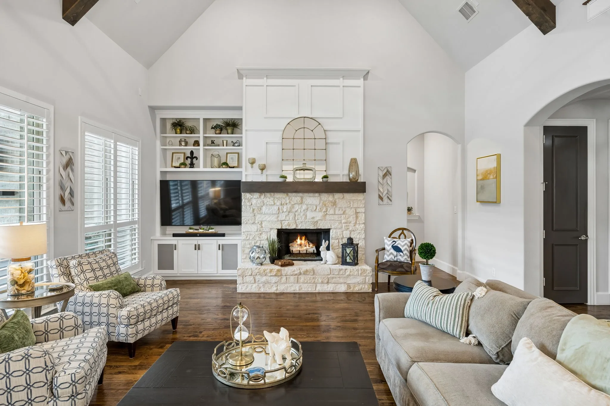Stone fireplace with gas logs and built in cabinet for tv