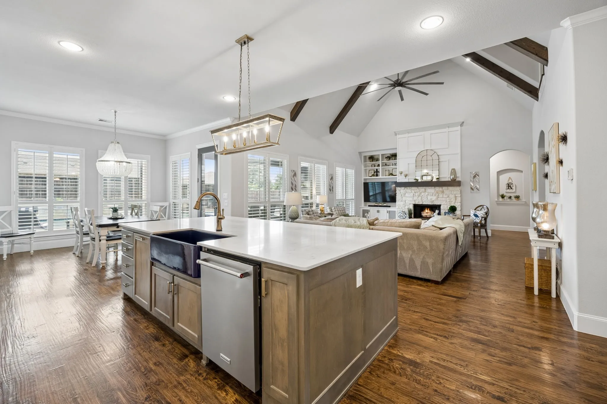 Open Living at its finest!  Casual dining leads to the Backyard Dream and kitchen and Family Room flow seamlessly.  Hardwood flooring brings so much warmth to the area.