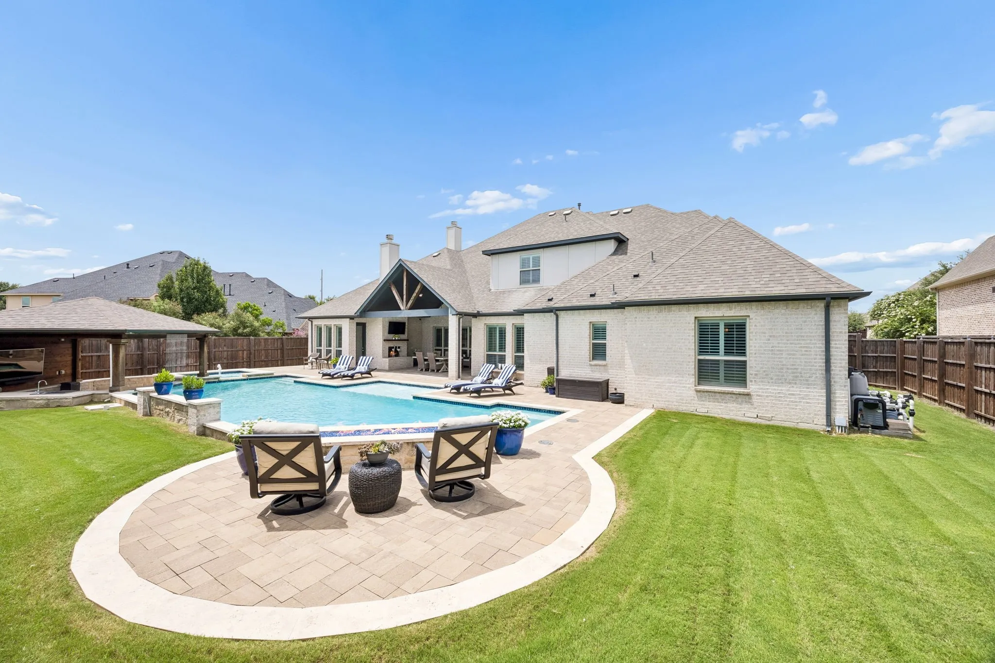3 waterfall features, firepit, and a rain waterfall near swim up bar.  Checks all the boxes for both indoor and outdoor entertaining
