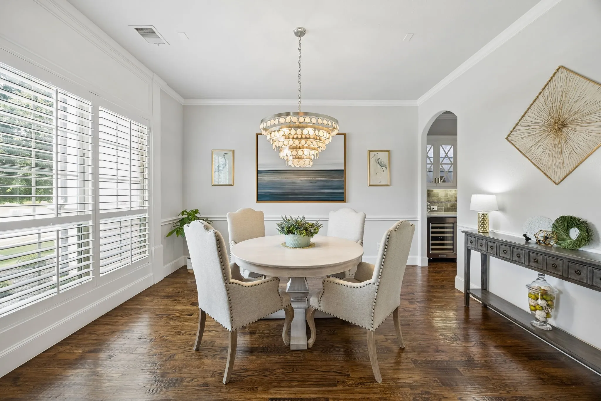 Formal Dining with chair railing and entry to Butlers area and Kitchen