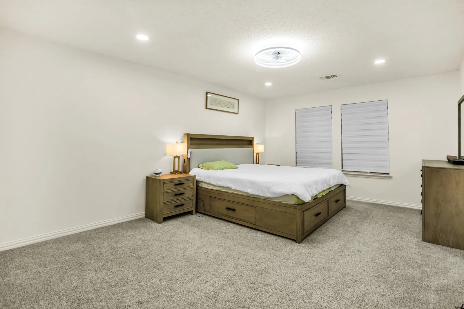 Carpeted room featuring recessed lighting and a ceiling-mounted light fixture