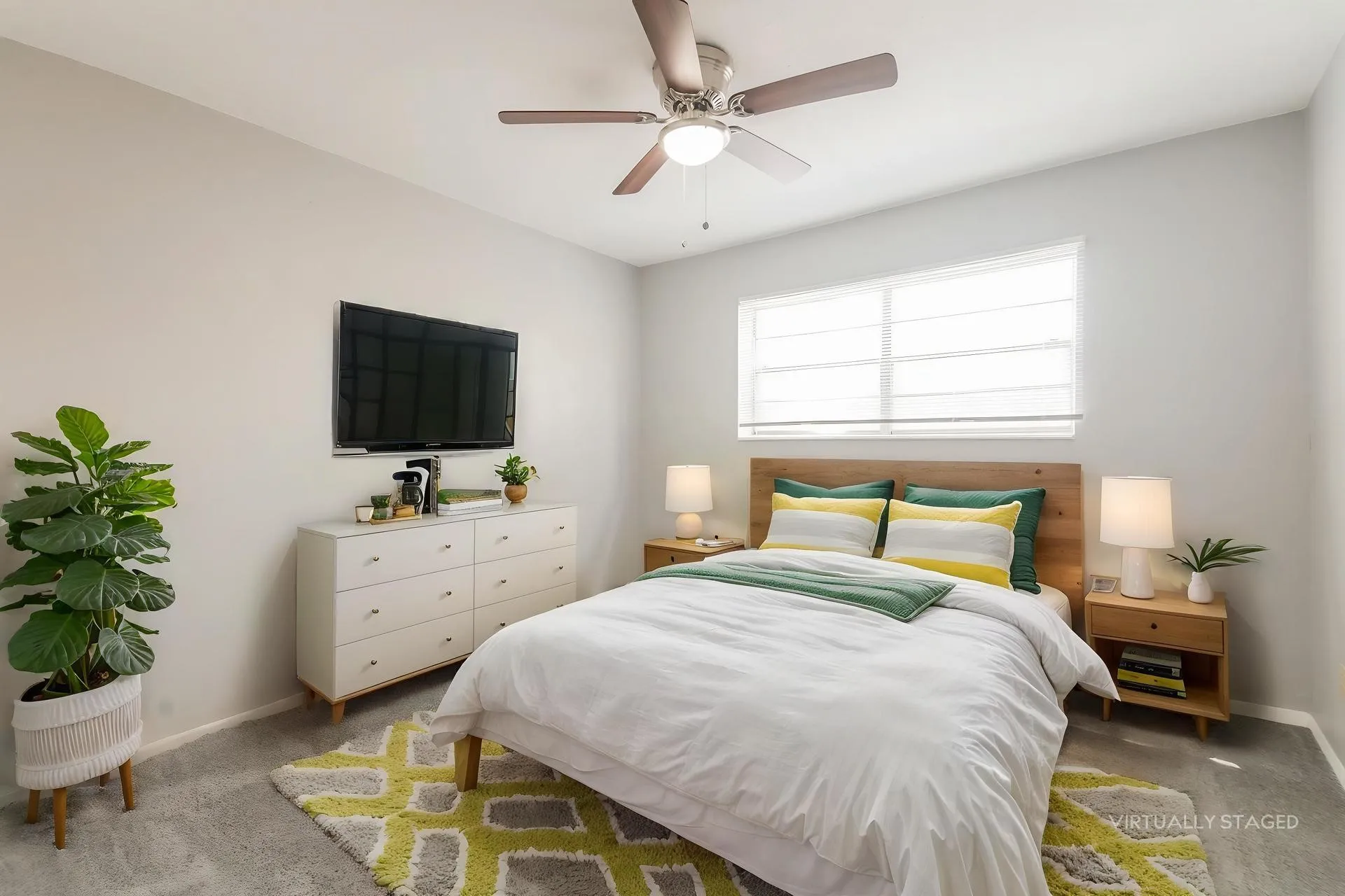 Carpeted room featuring light gray walls, a window with blinds, and a ceiling fan with light fixture