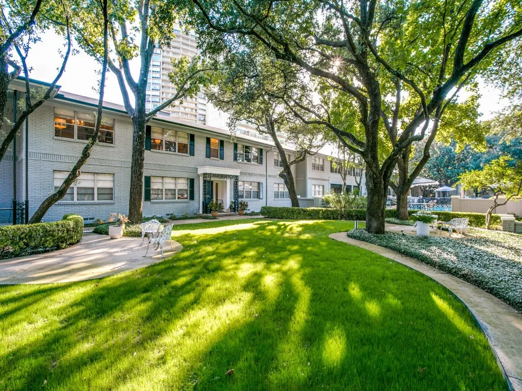 Beautiful mature trees adorn the entire property projecting a high-end vibe - with a location this close to the Park Cities you will LOVE living "Behind the Pink Wall"