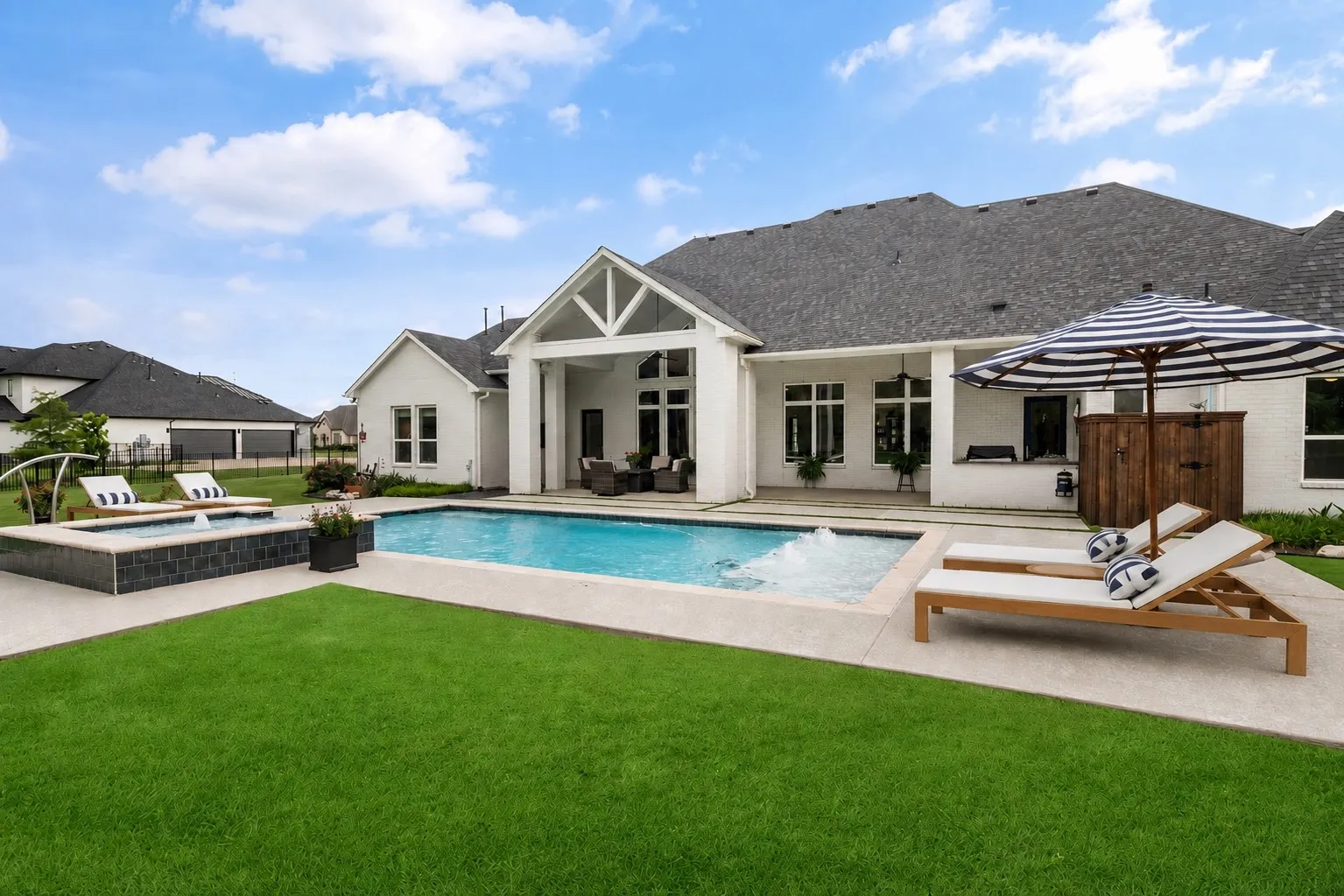 Outside pool furniture is virtually staged.
