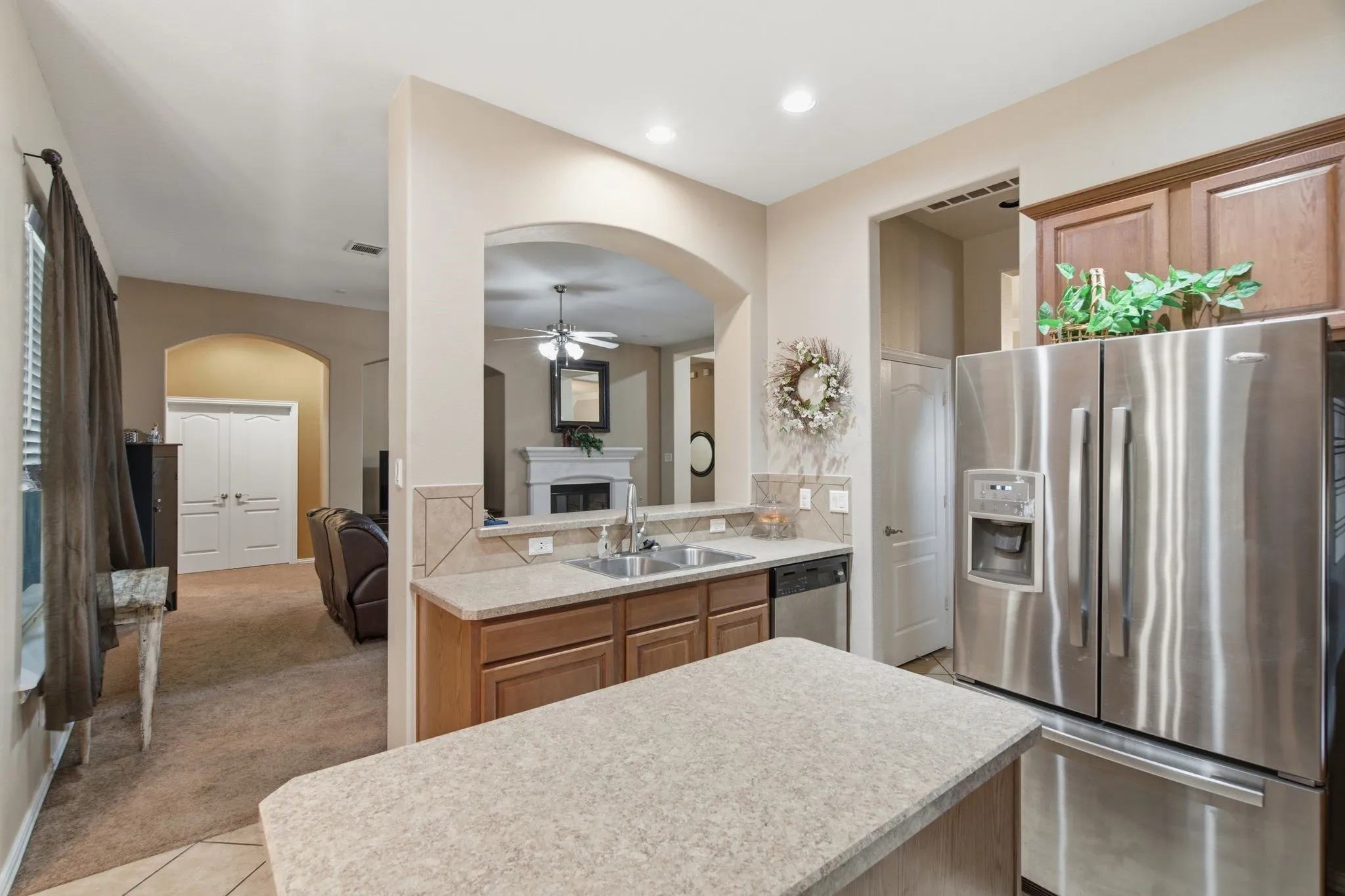 Kitchen featuring wood cabinetry, stainless steel appliances, and a double basin sink