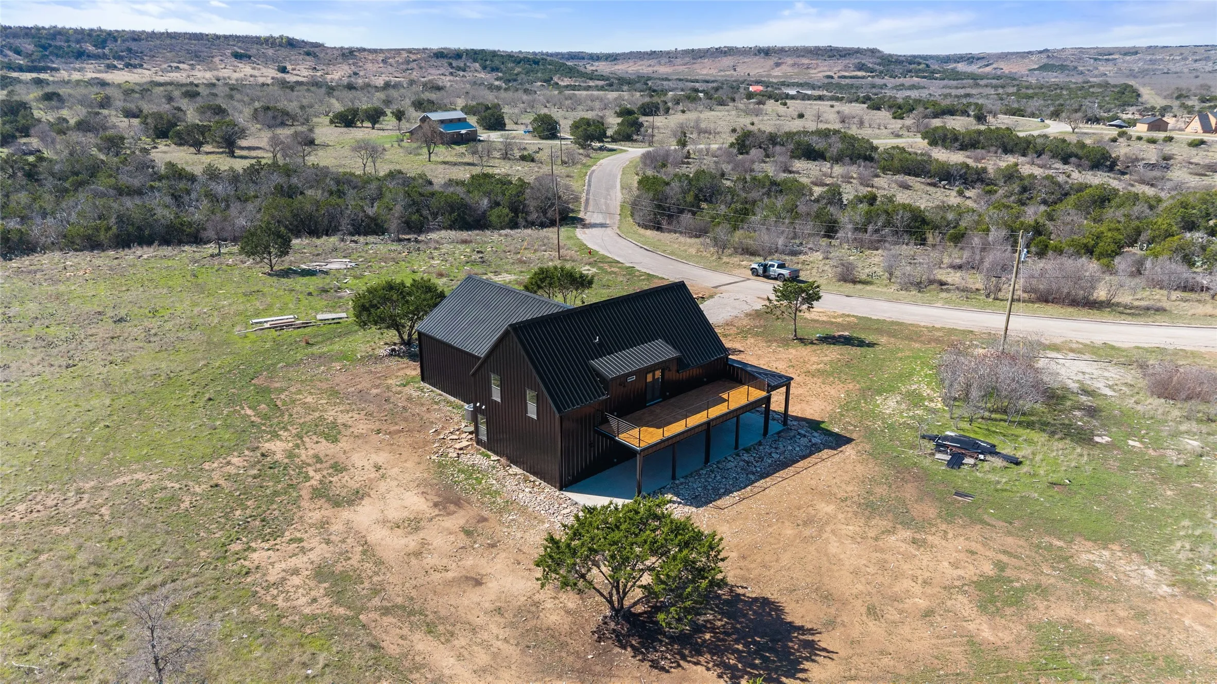 Modern build with dark siding and metal roof
