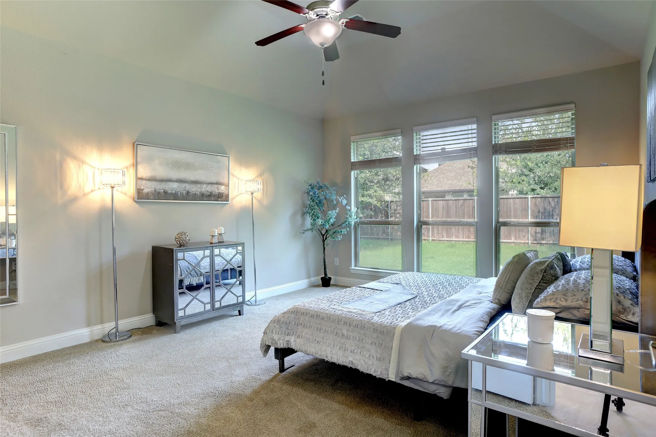 Wall-to-wall carpeting and neutral wall tones create a serene atmosphere