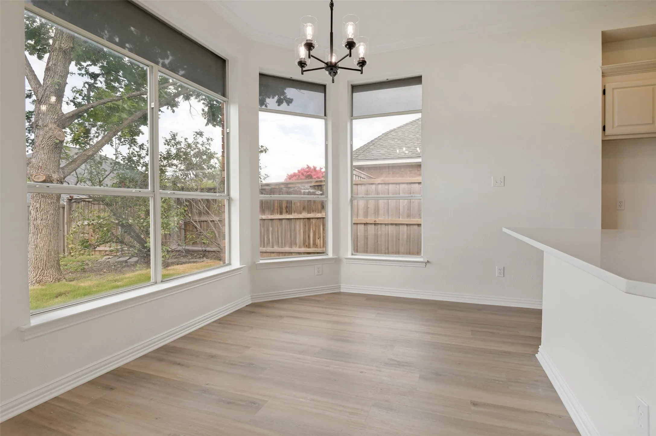 Bay window with multiple large panes, providing abundant natural light