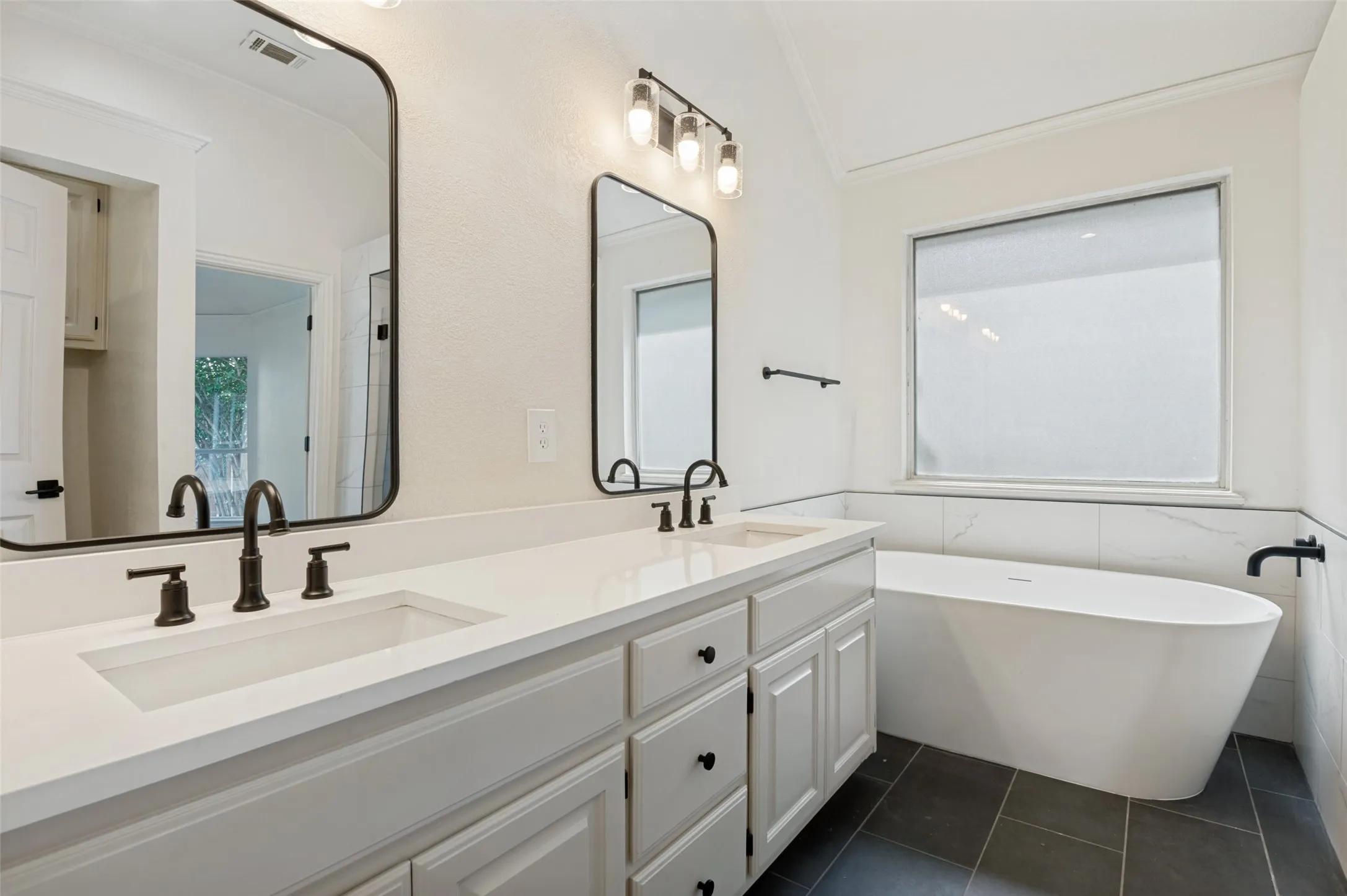 Dual vanity with integrated sinks and white countertops