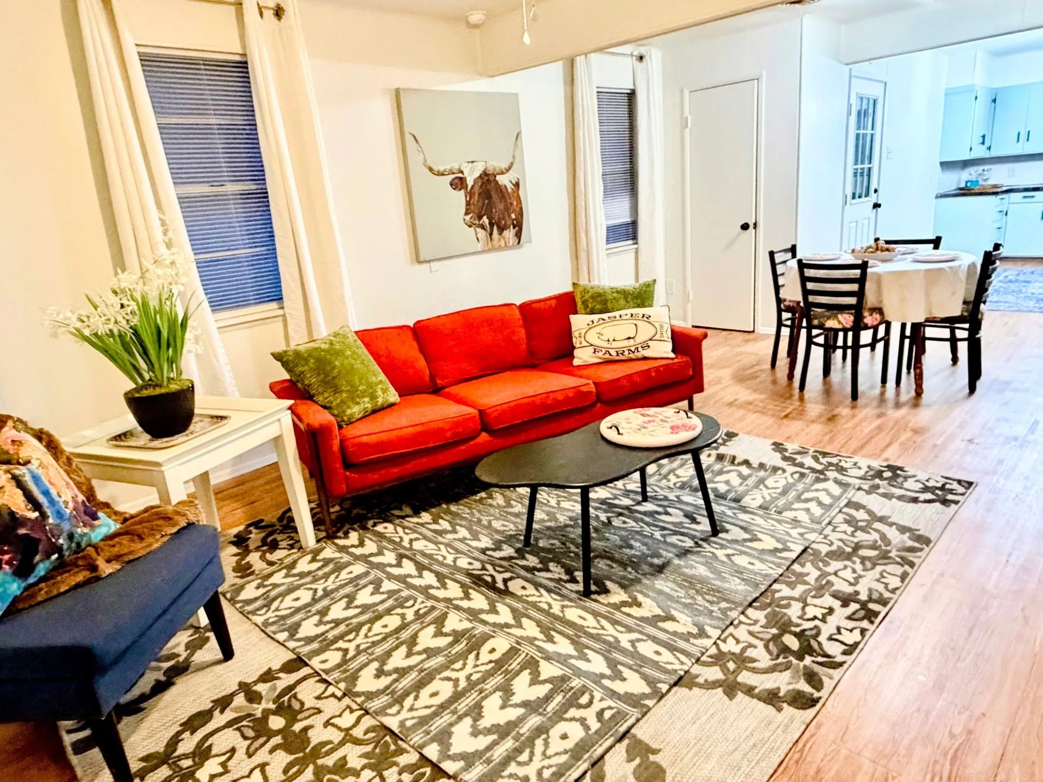 Open-concept living space featuring wood-finish flooring