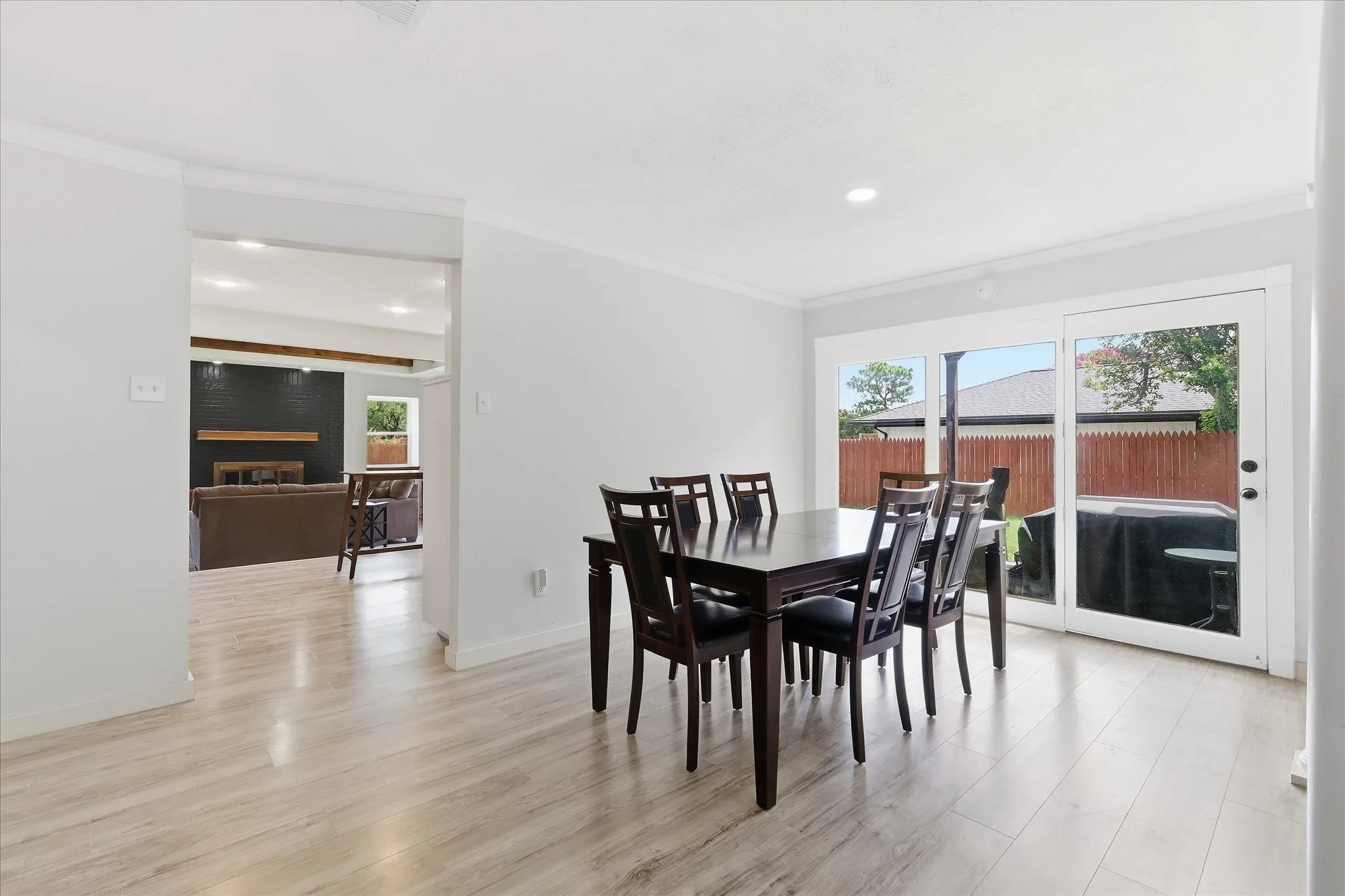 Light wood-finish flooring extends throughout this interior space