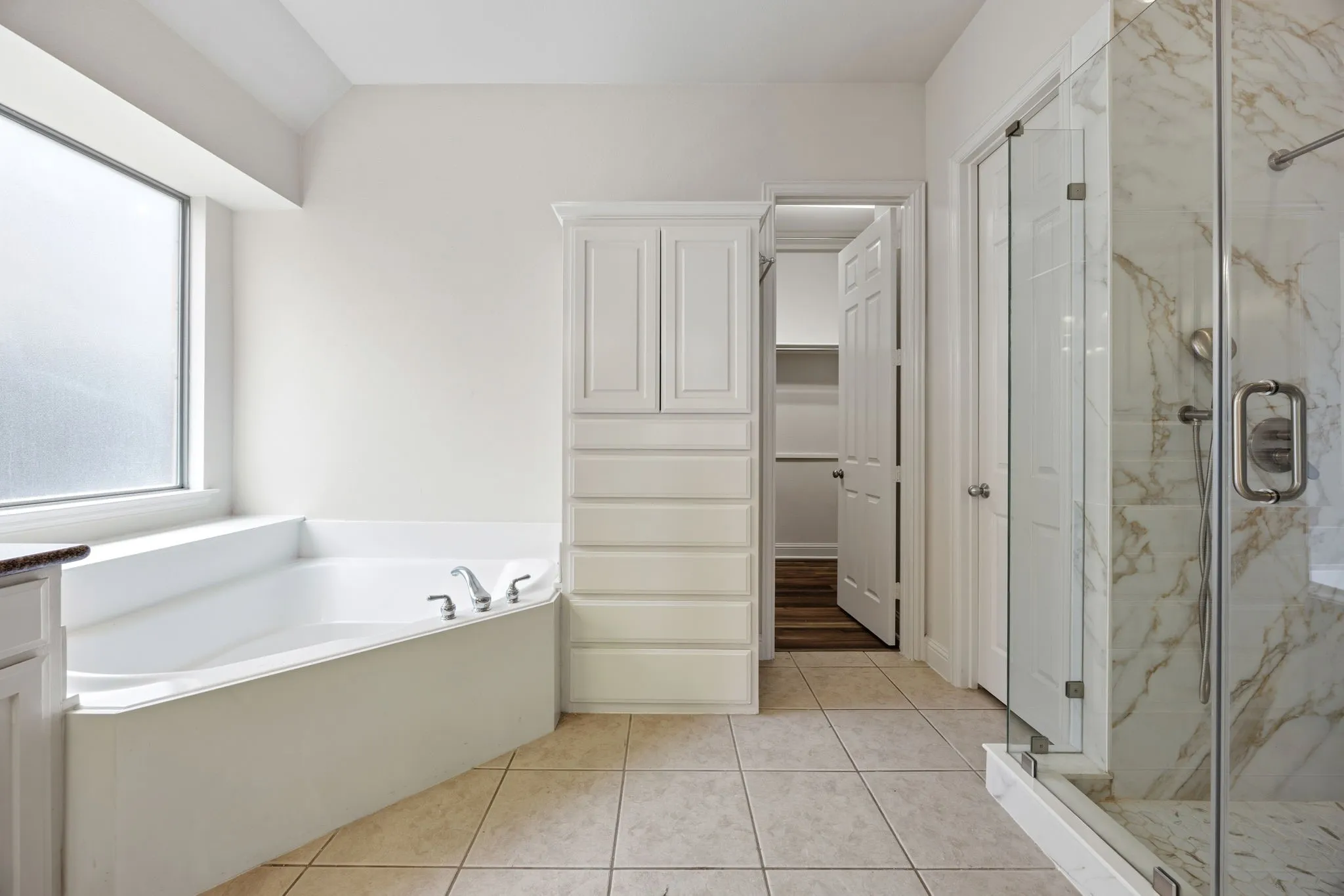 Master Bathroom Stand up shower. You get a glimpse of master closet