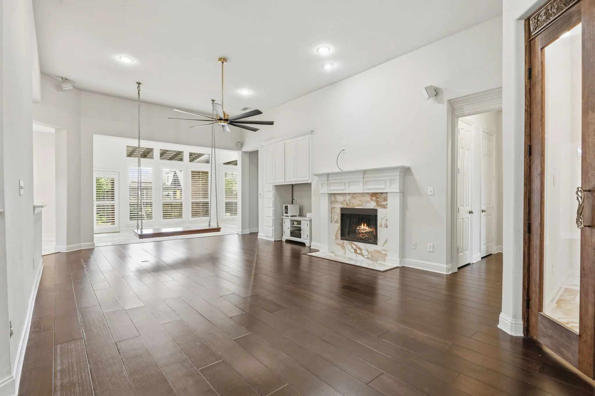 Living room, right door is office, the hallway after leads to guest bedroom and bathroom.