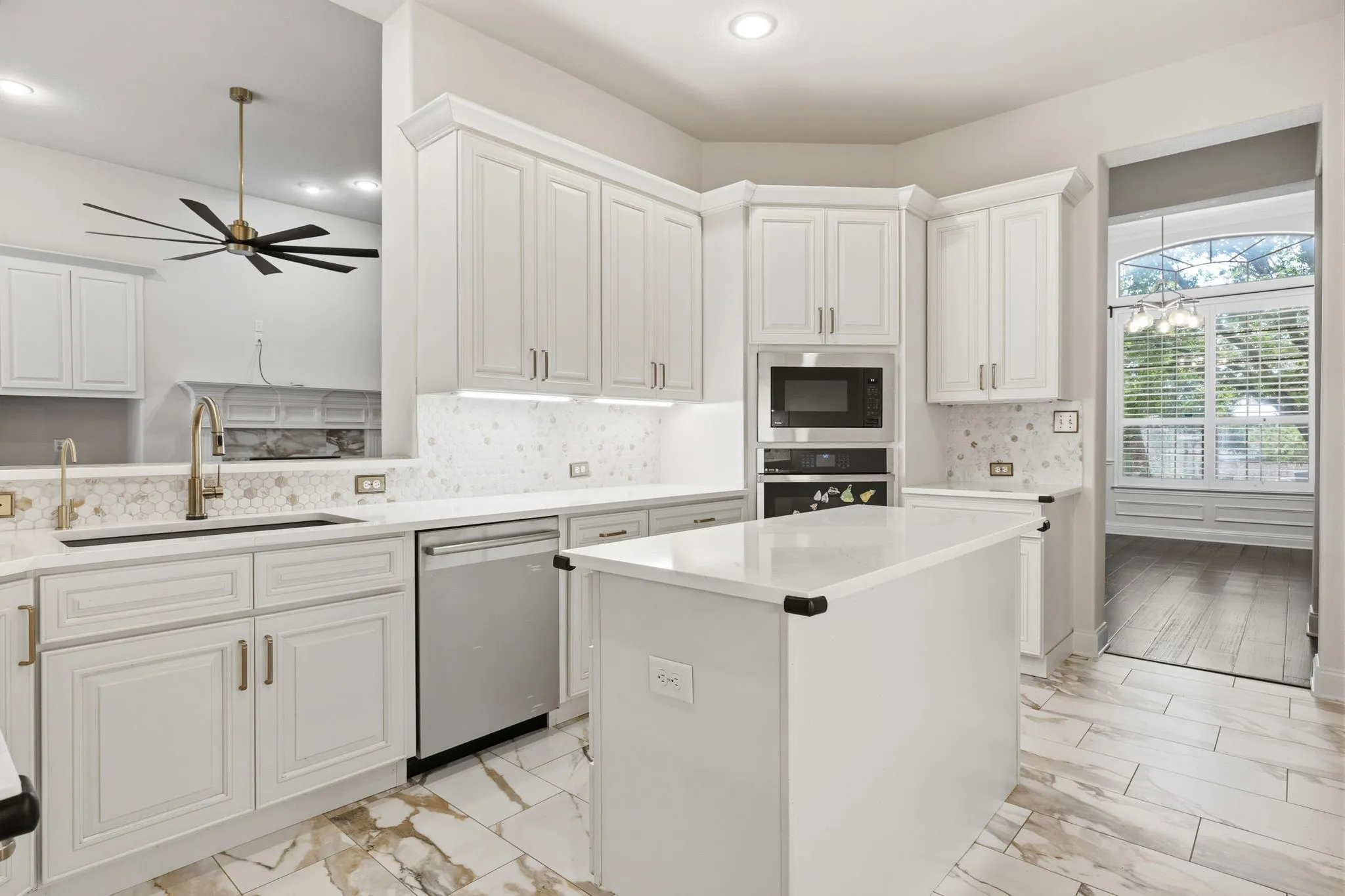 Kitchen with SS appliance RO water, farm sink. You get a glimpse of opening to formal dining
