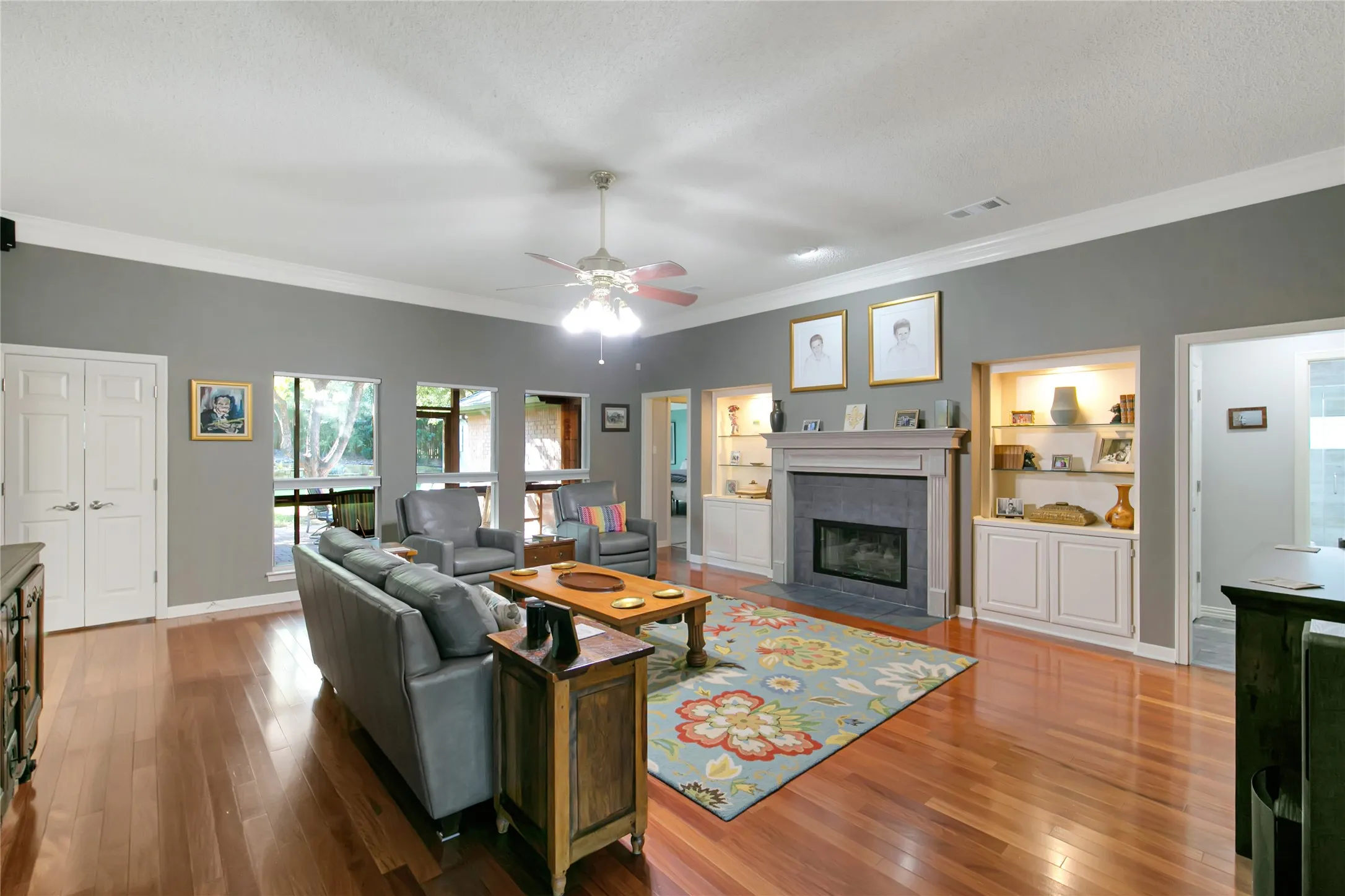 View of the family room from the entry area.  Notice the built ins and the gas fireplace.