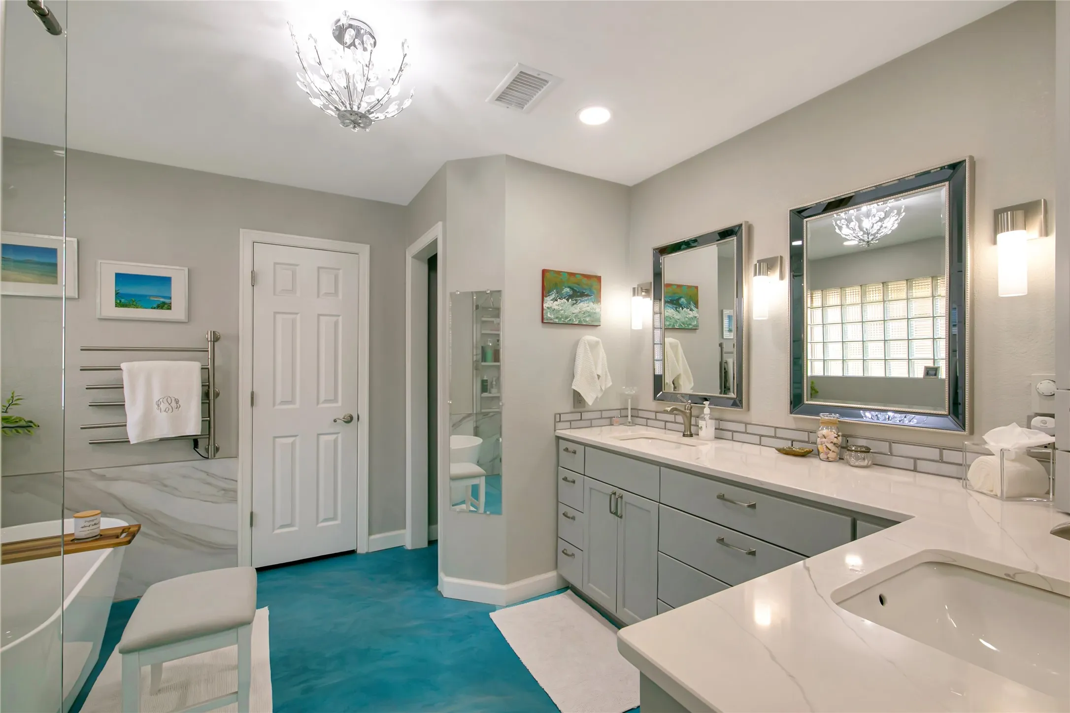 Stunning primary bathroom has been nicely updated with quartz counters, dual sinks, walk in shower, and stand alone tub.  Don't forget to check out the walk in closet!