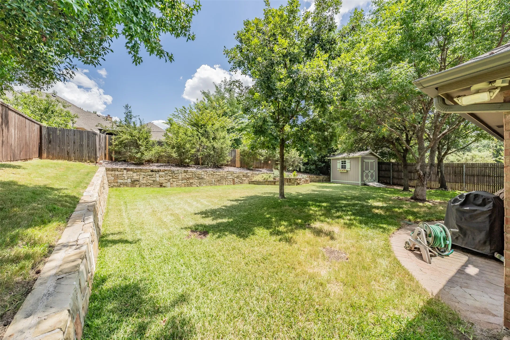 Wait until you step into the back yard.  It is so peaceful with all the beautiful trees.
