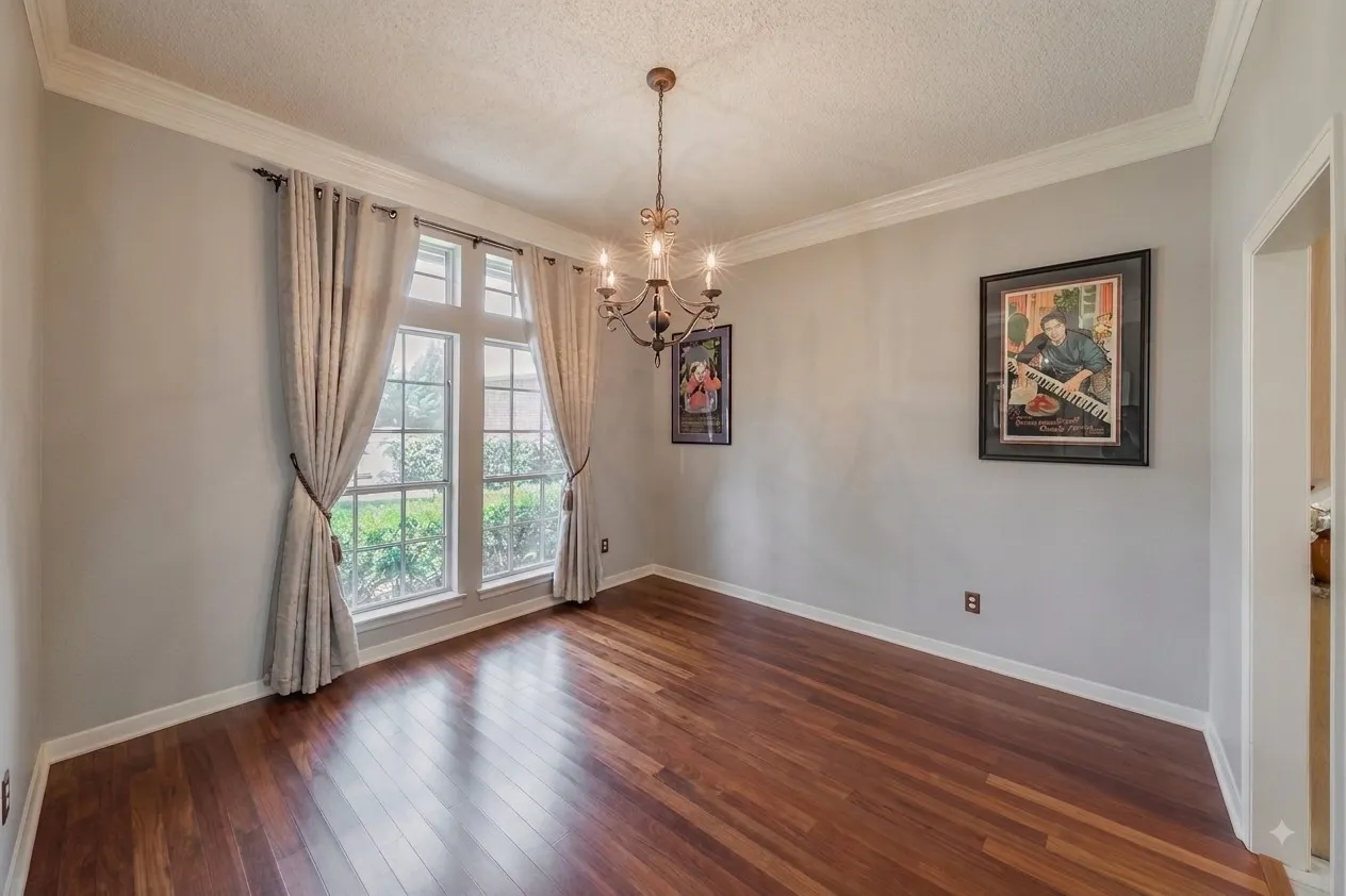 Enhanced with AI. All of the furniture has been removed so you can picture what you would do with this room.