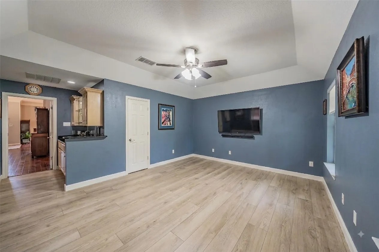 Enhanced with AI. All furniture has been removed.  Would you make this an office, 4th bedroom or workout room?  The options are endless.
