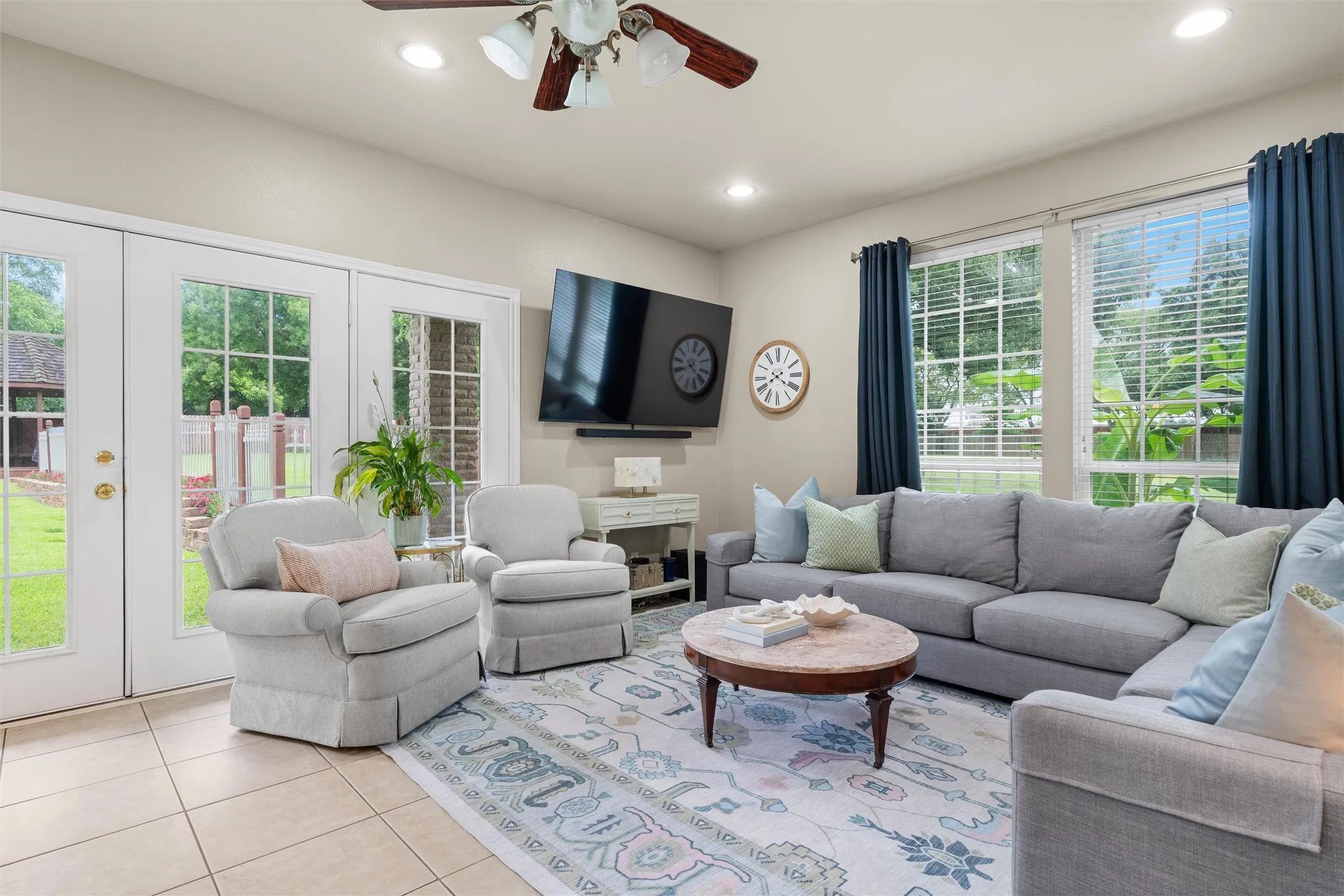 This guest house has it all. Living area with tile flooring and multiple windows