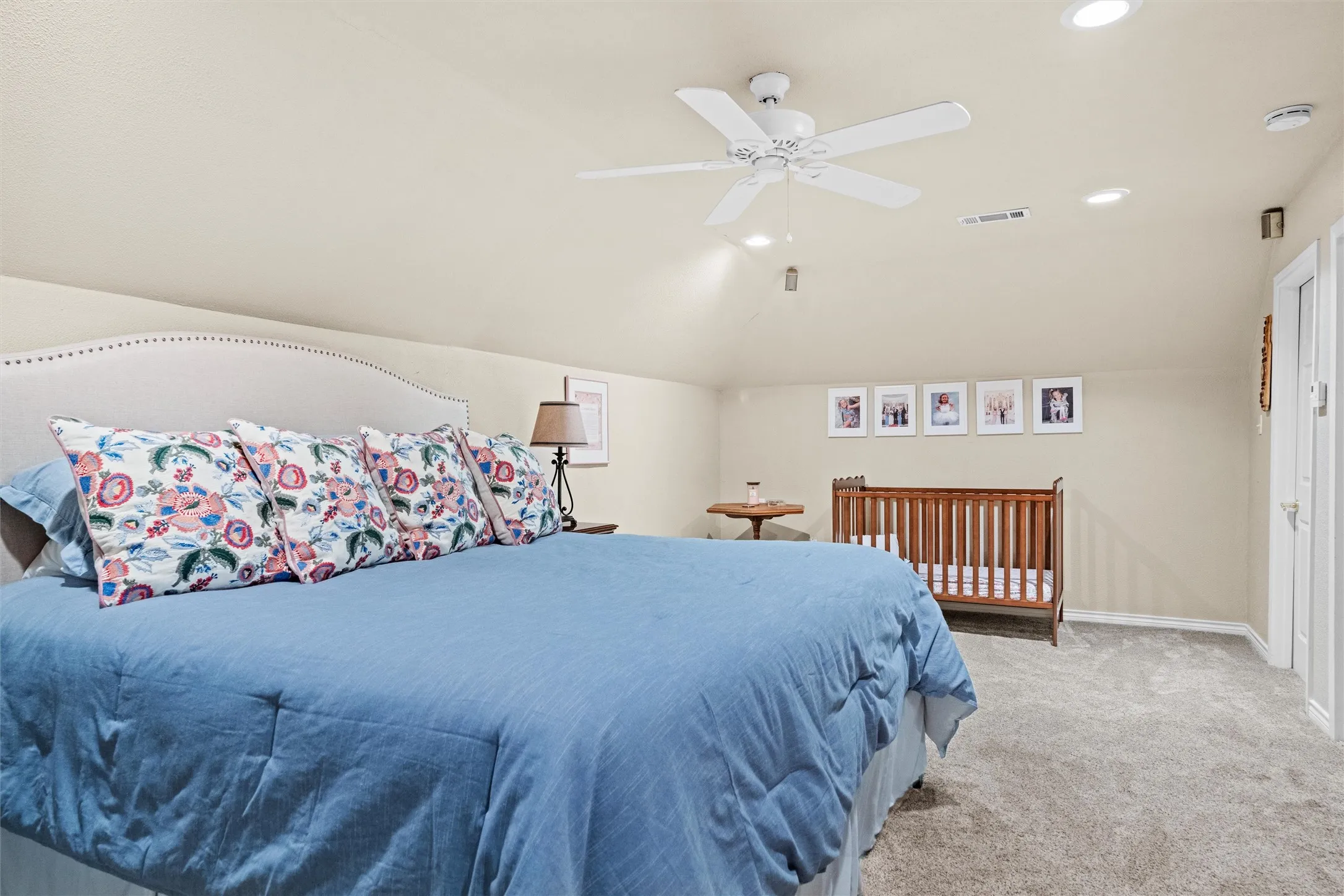 Spacious room on the 2nd level. Could be 5th bedroom or hobby room featuring vaulted ceilings, light neutral wall paint, recessed lighting, a ceiling fan, and carpet flooring.