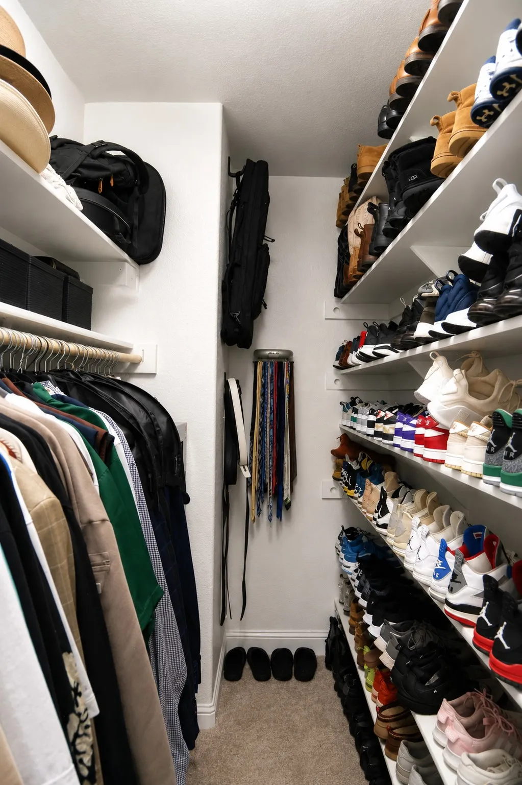 Built-in closet organization system featuring extensive shelving and hanging rods