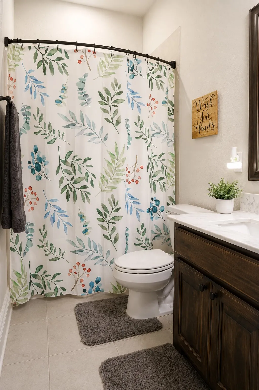 Bathroom featuring a built-in vanity with dark wood-finish cabinetry, a white countertop, and an integrated rectangular sink