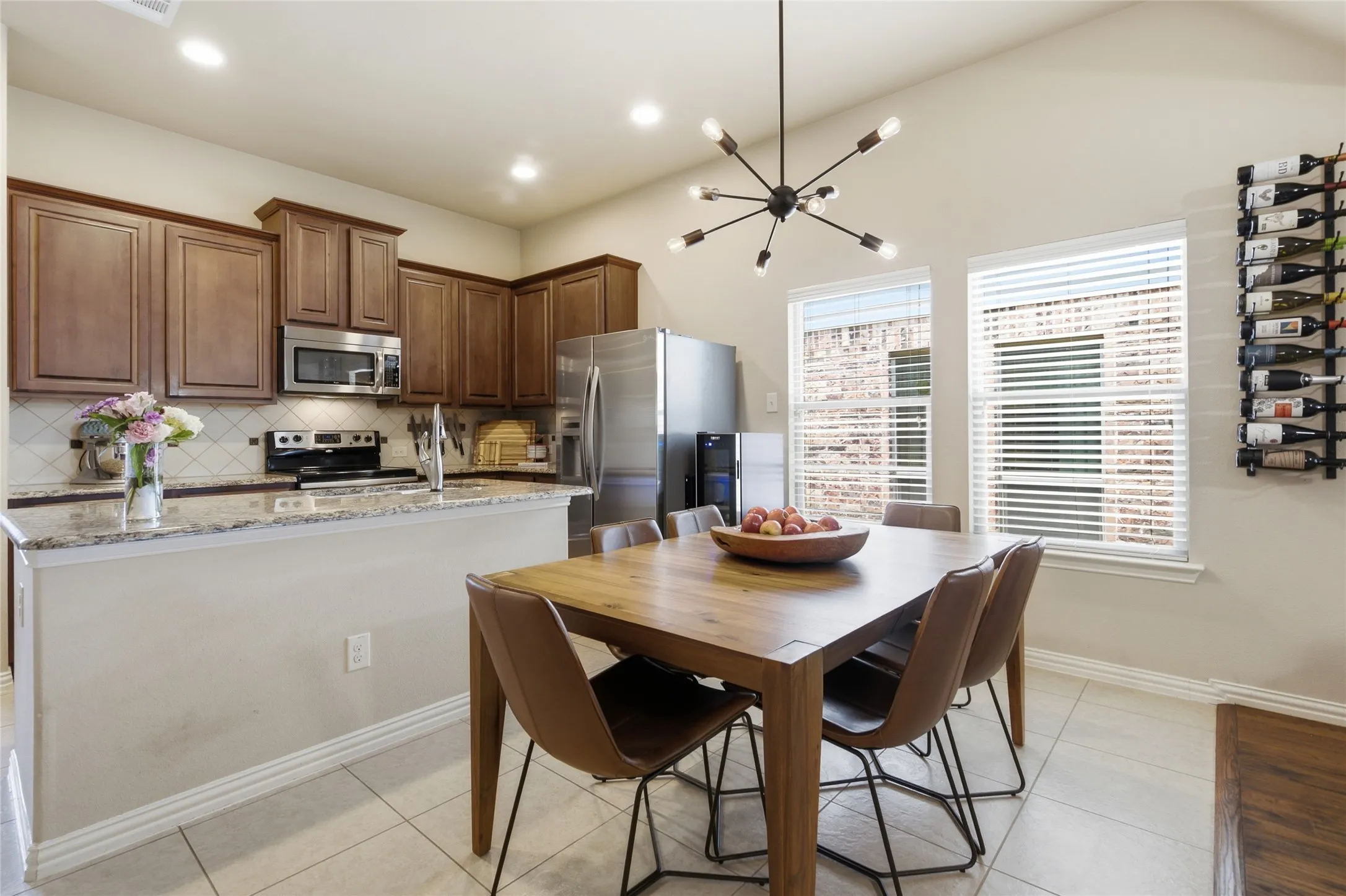 Kitchen and dining area featuring a vaulted ceiling and an open-concept layout