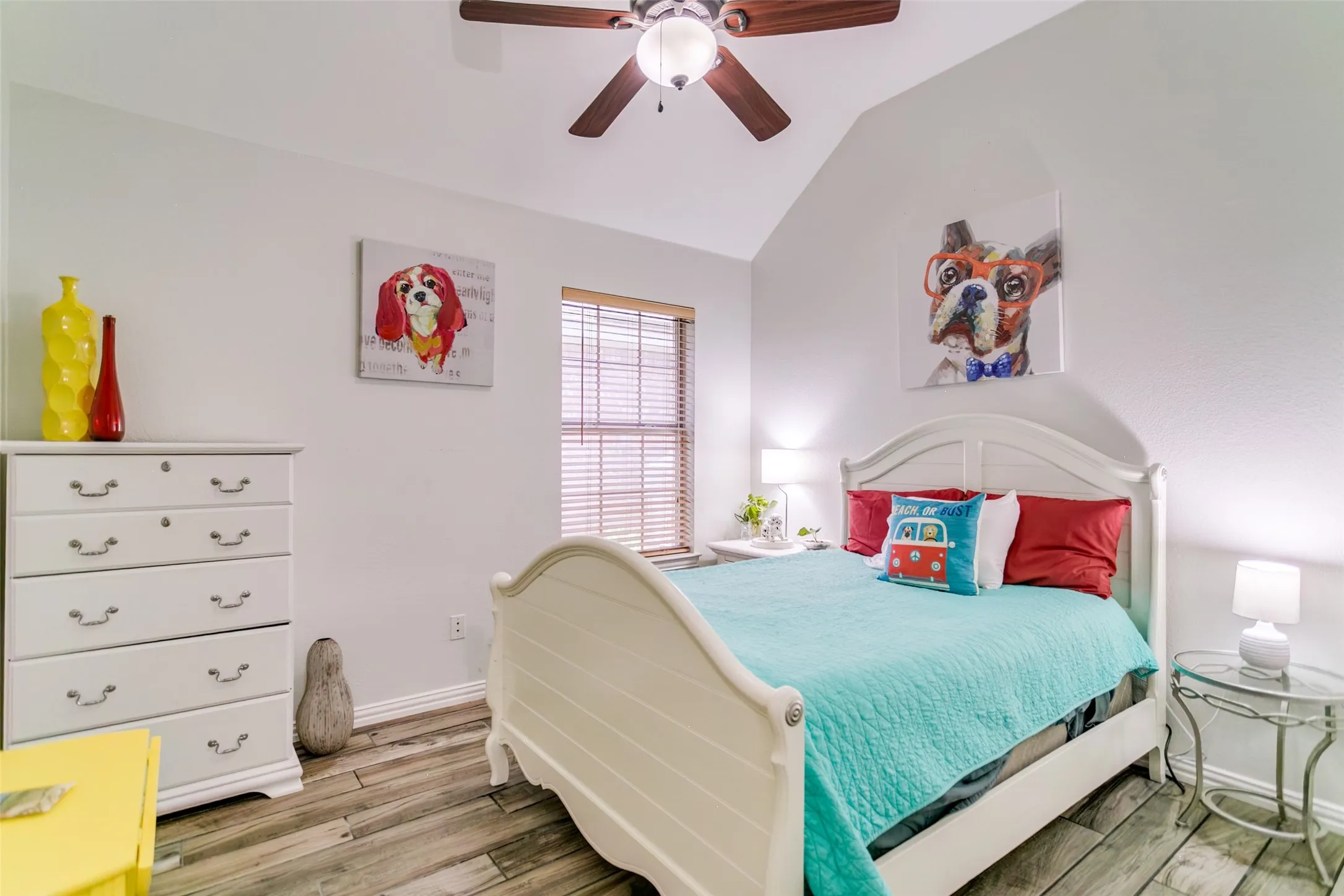 Secondary bedroom with high ceilings.