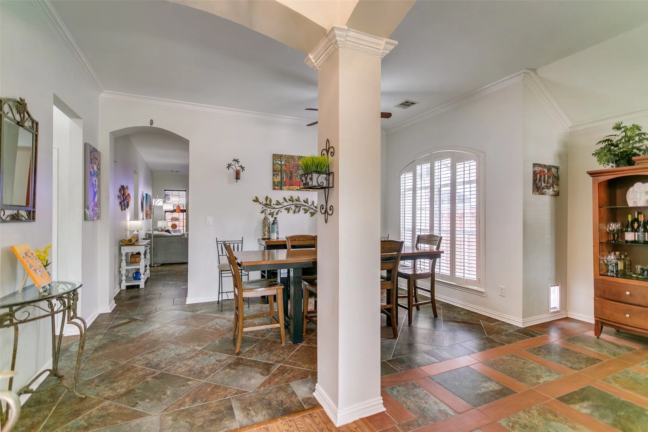 Formal dining room in the front of the home with travertine flooring. Lots of natural light.
