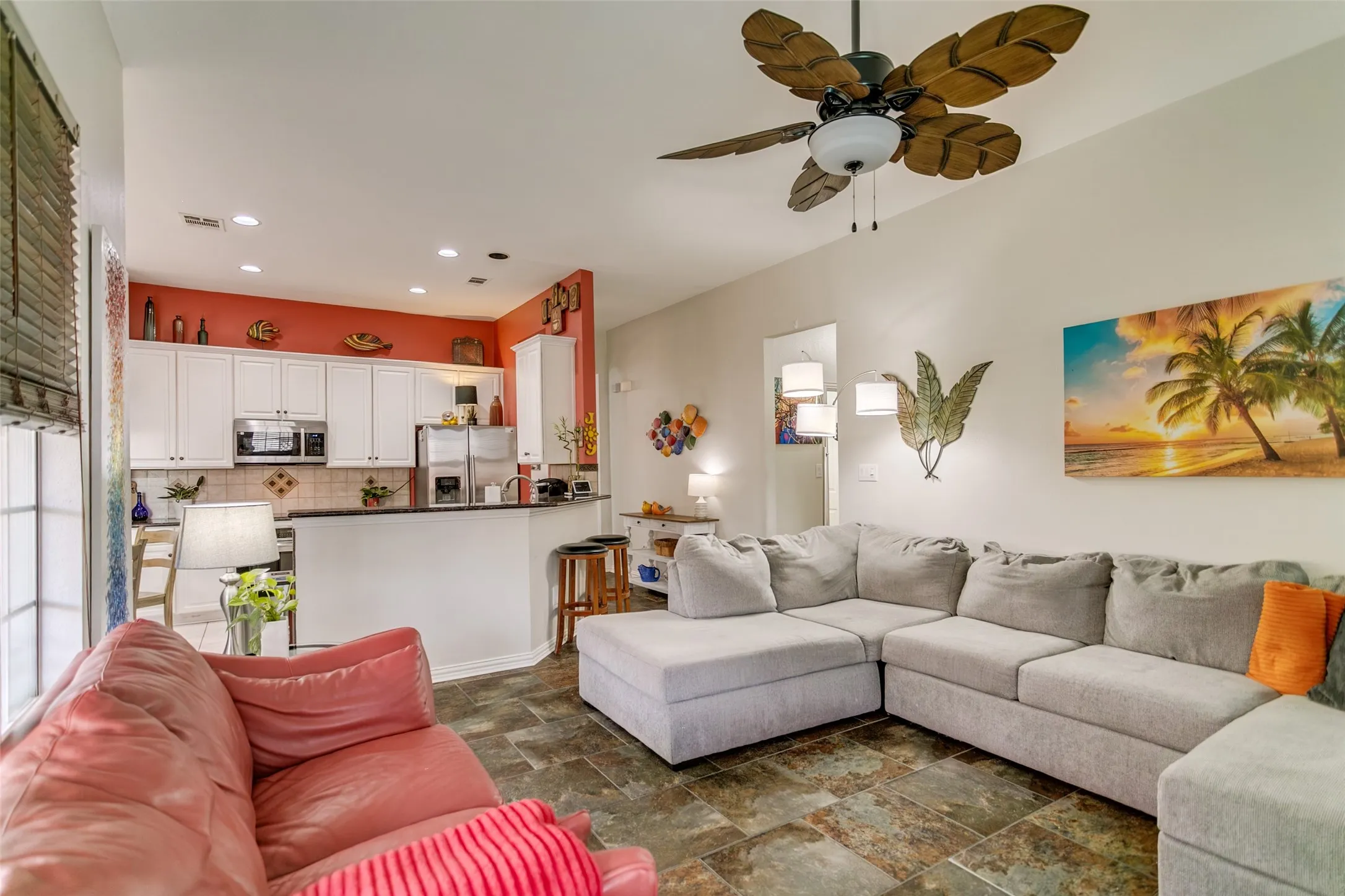 Kitchen opens to the family room with breakfast area and bar seating.