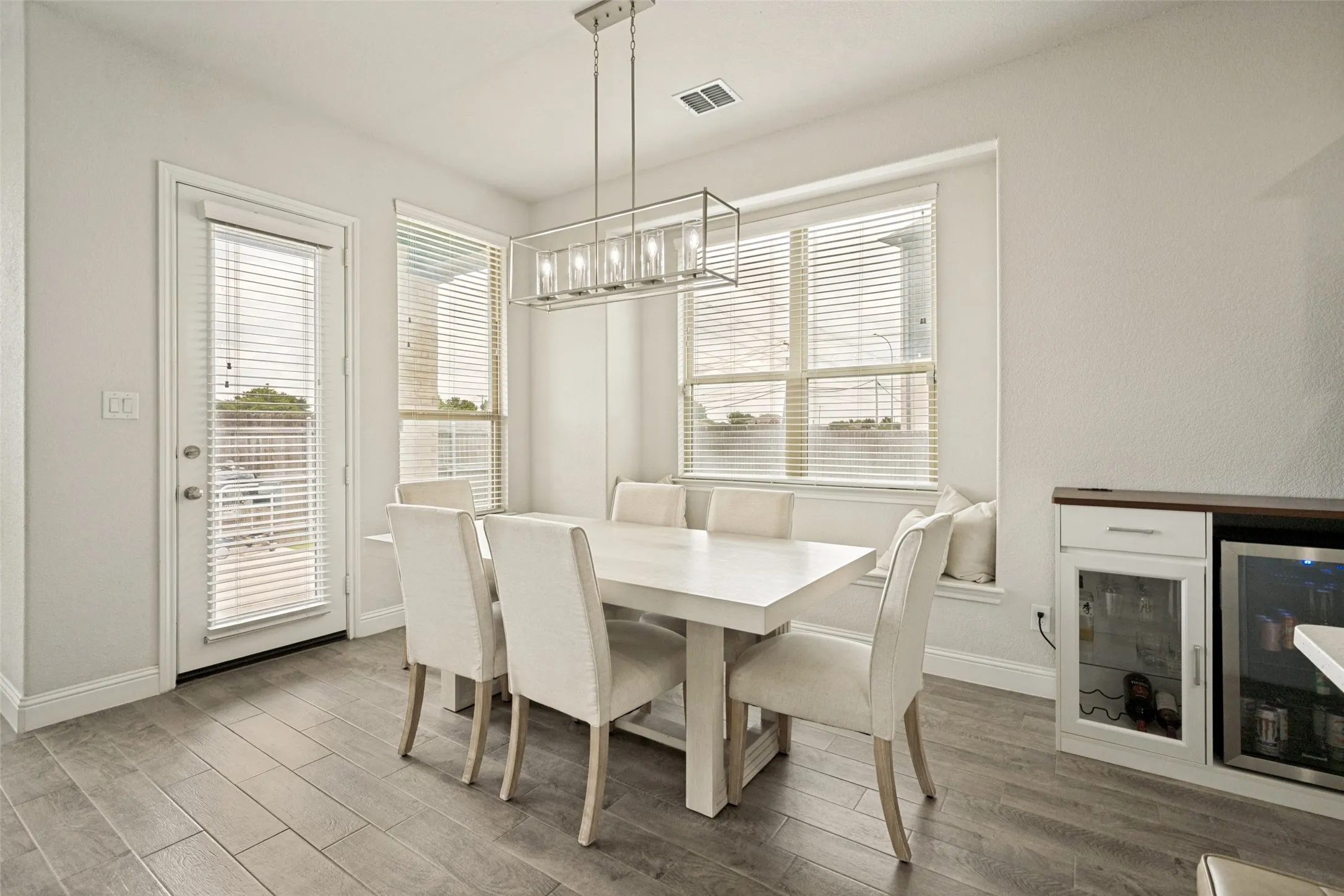 Open concept dining area featuring wood-finish flooring