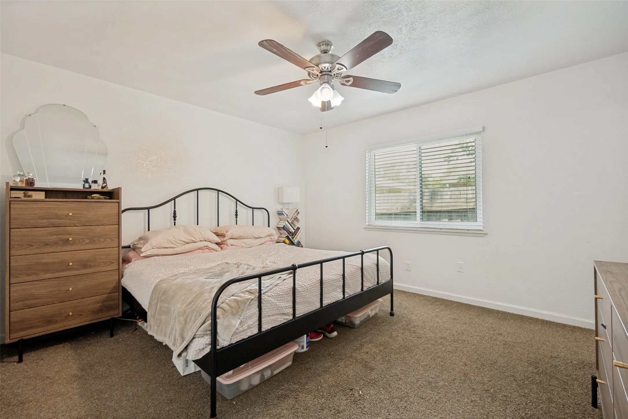 Bedroom featuring neutral-toned carpet flooring and white walls
