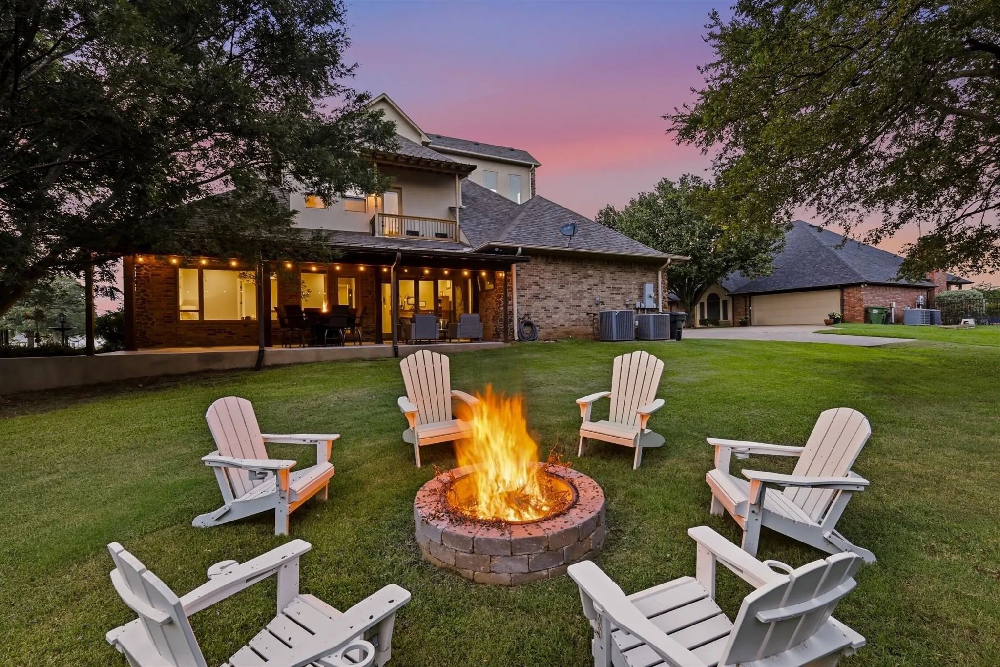 The shaded back yard has a built in fire pit perfect for cozy nights! At the end of the driveway, there is RV and boat hookups.