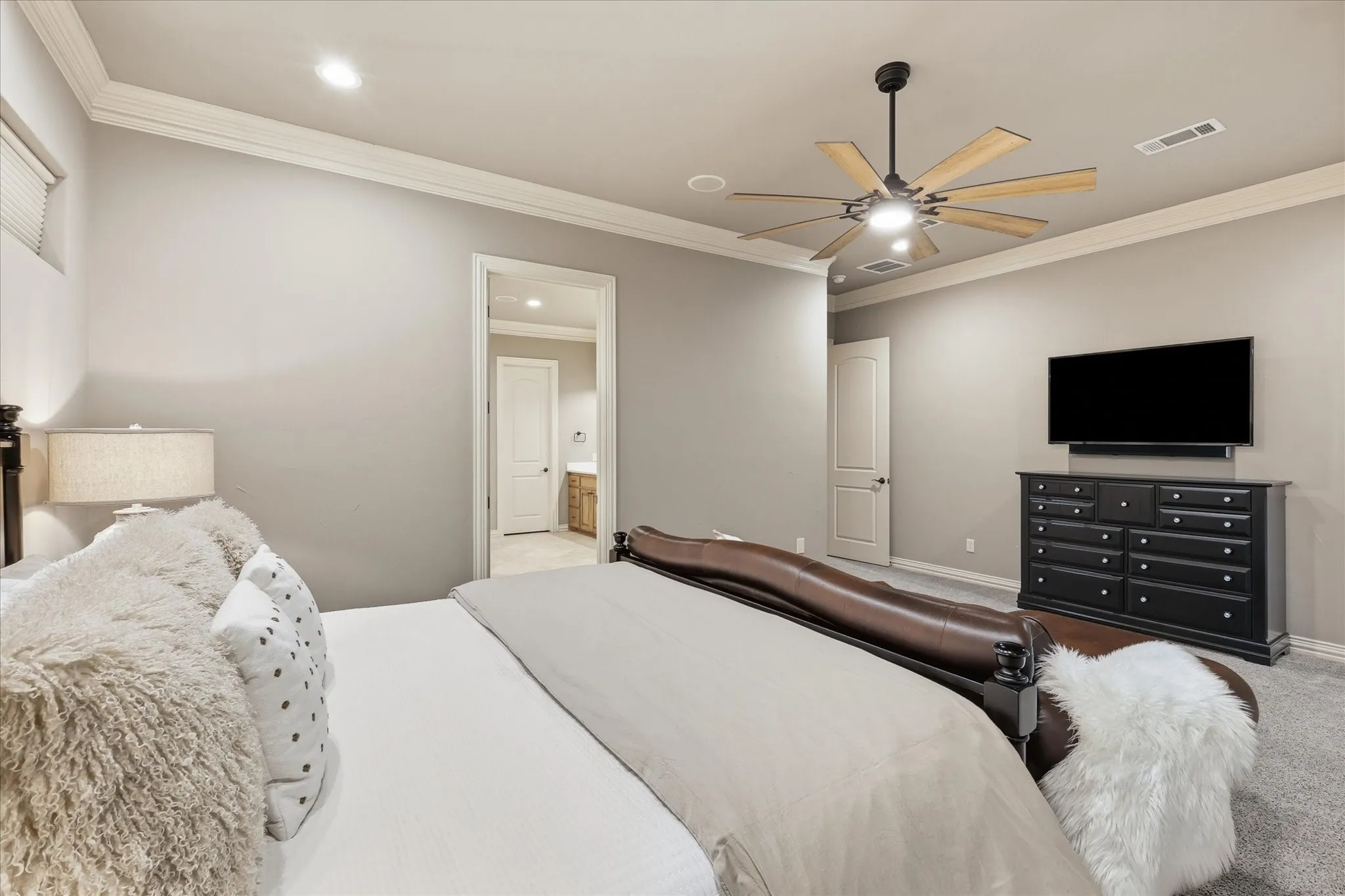 The primary bedroom leads to a huge, luxurious ensuite bath.